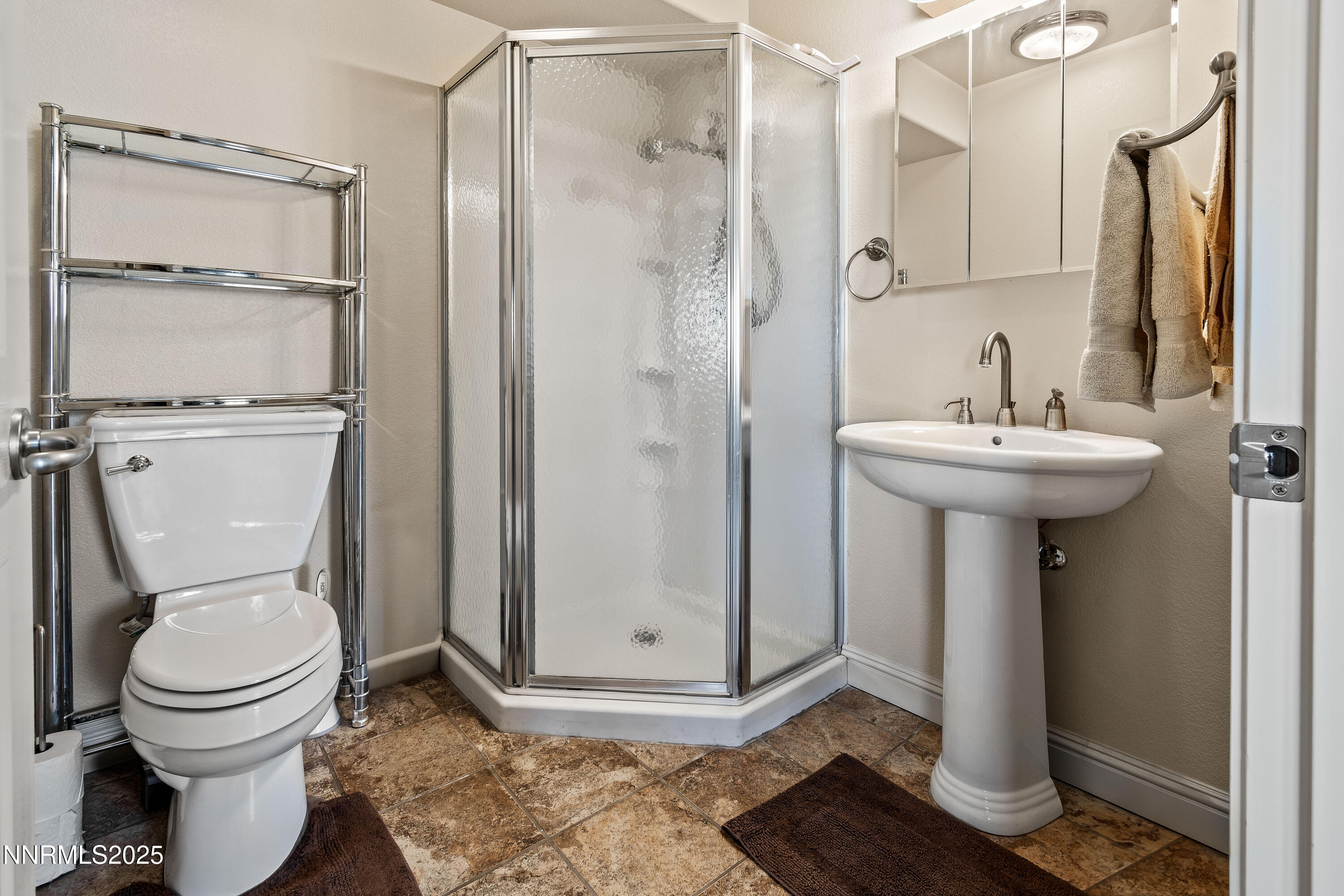 2140 Conestoga Road Reno, NV 89521 - Photo 27 of 35 a bathroom with a sink toilet and shower
