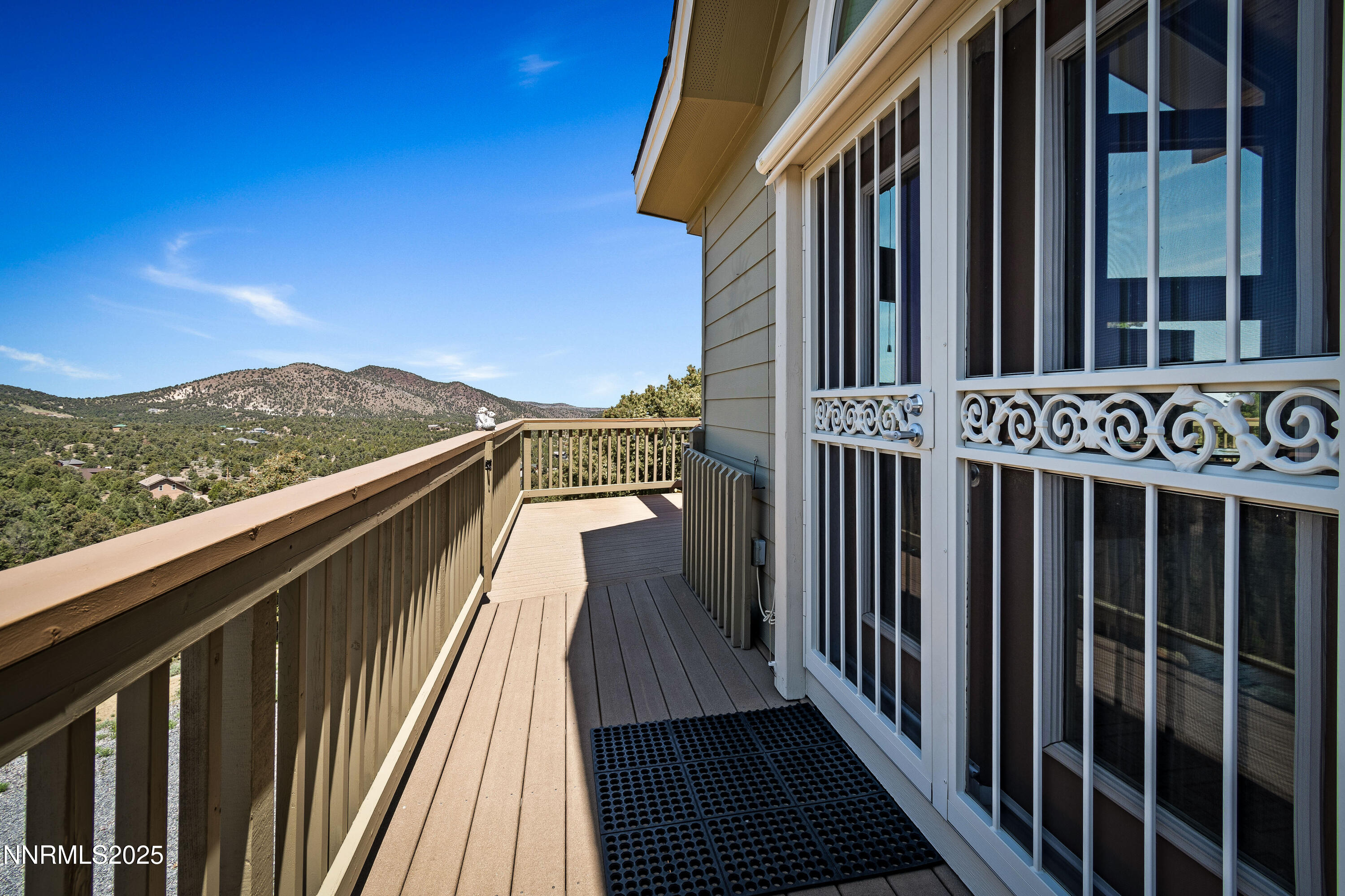 2140 Conestoga Road Reno, NV 89521 - Photo 31 of 35 a view of a balcony with wooden floor and fence