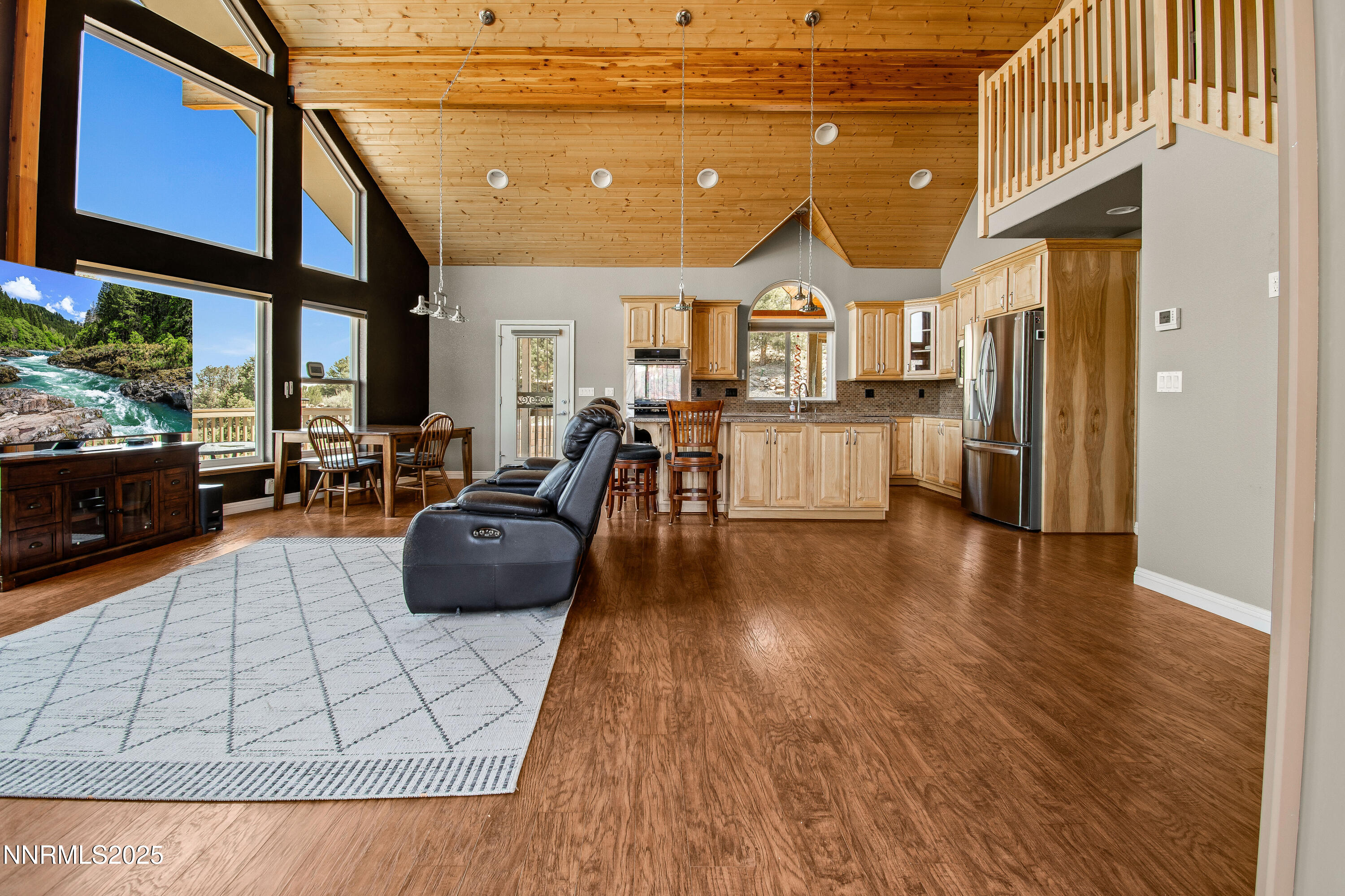 2140 Conestoga Road Reno, NV 89521 - Photo 5 of 35 a living room with furniture and a wooden floor