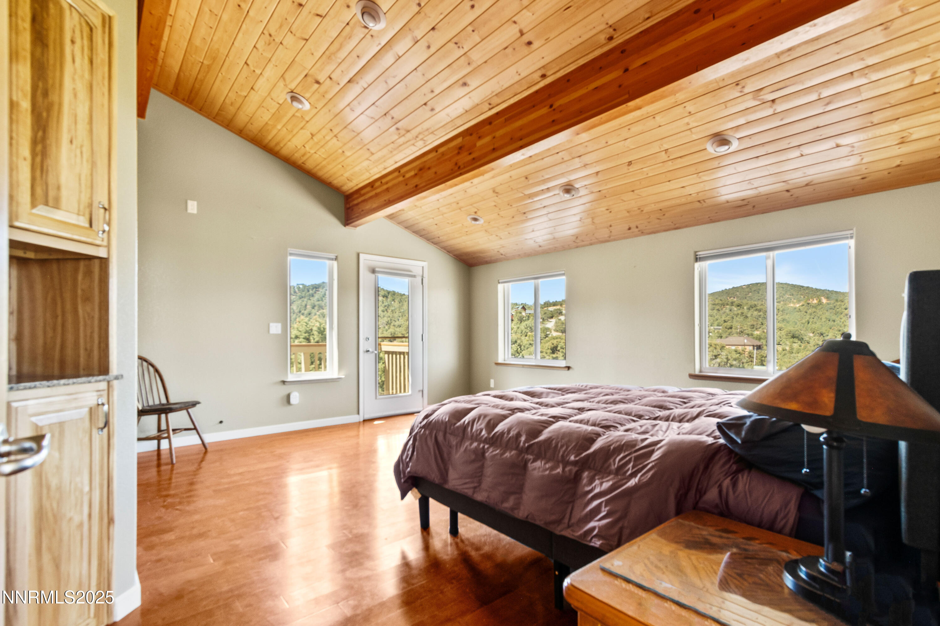 2140 Conestoga Road Reno, NV 89521 - Photo 9 of 35 a bedroom with a bed and wooden floor