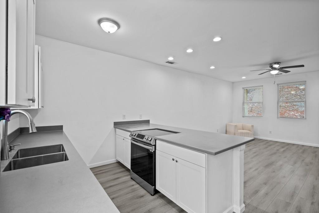 657 Summit Lane Ellijay, GA 30540 - Photo 12 of 33 a kitchen that has a sink and a stove