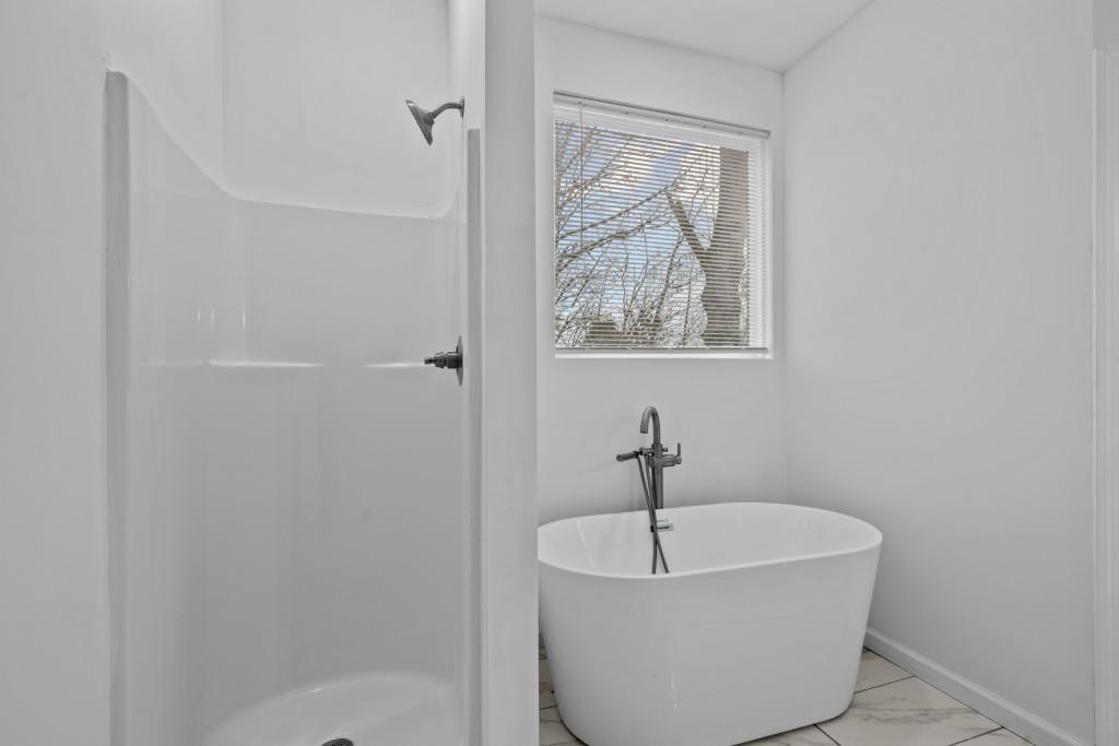 657 Summit Lane Ellijay, GA 30540 - Photo 21 of 33 a white bath tub sitting in a bathroom