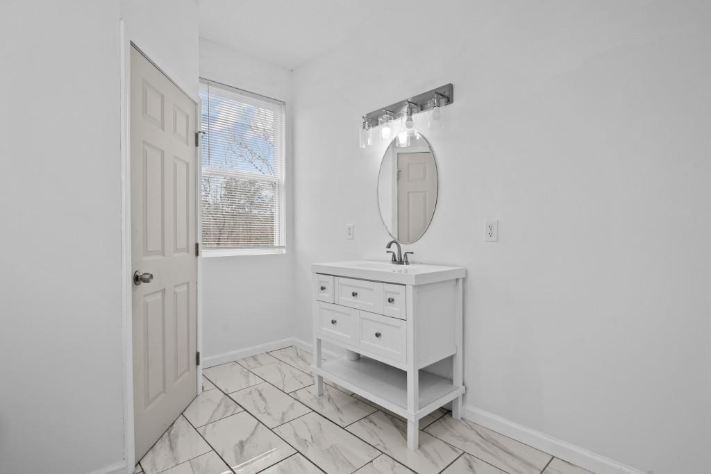 657 Summit Lane Ellijay, GA 30540 - Photo 22 of 33 a view of a bathroom with mirror and window