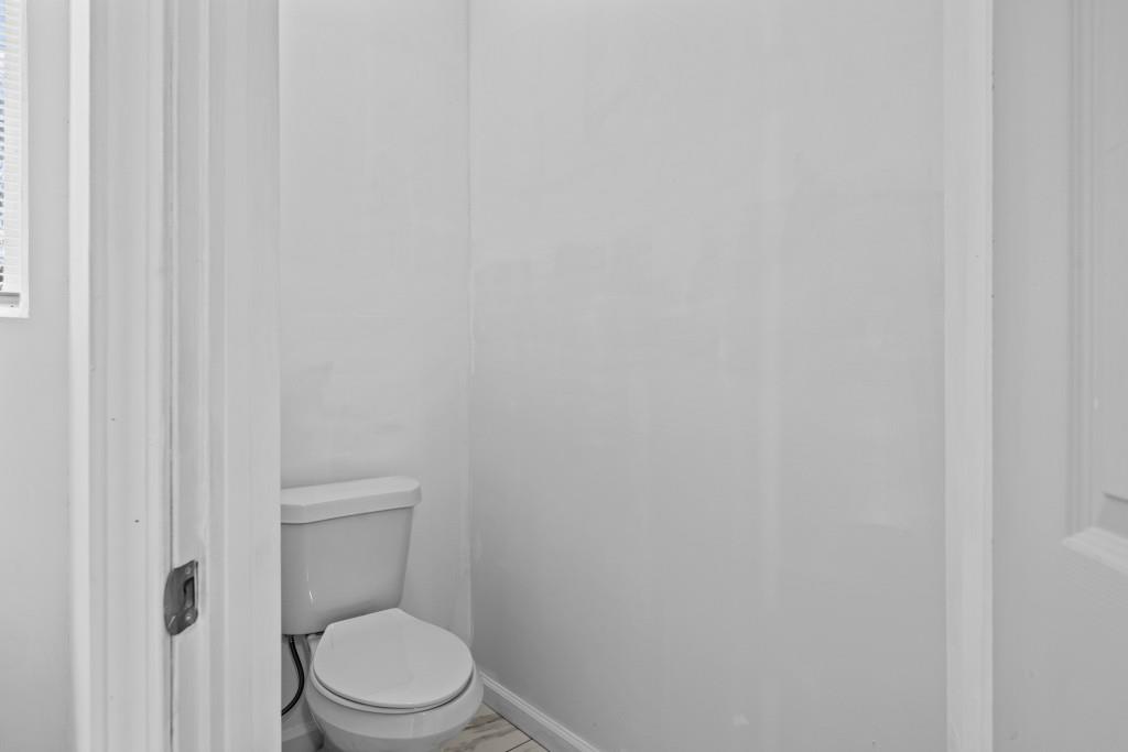 657 Summit Lane Ellijay, GA 30540 - Photo 23 of 33 a white toilet sitting next to a shower