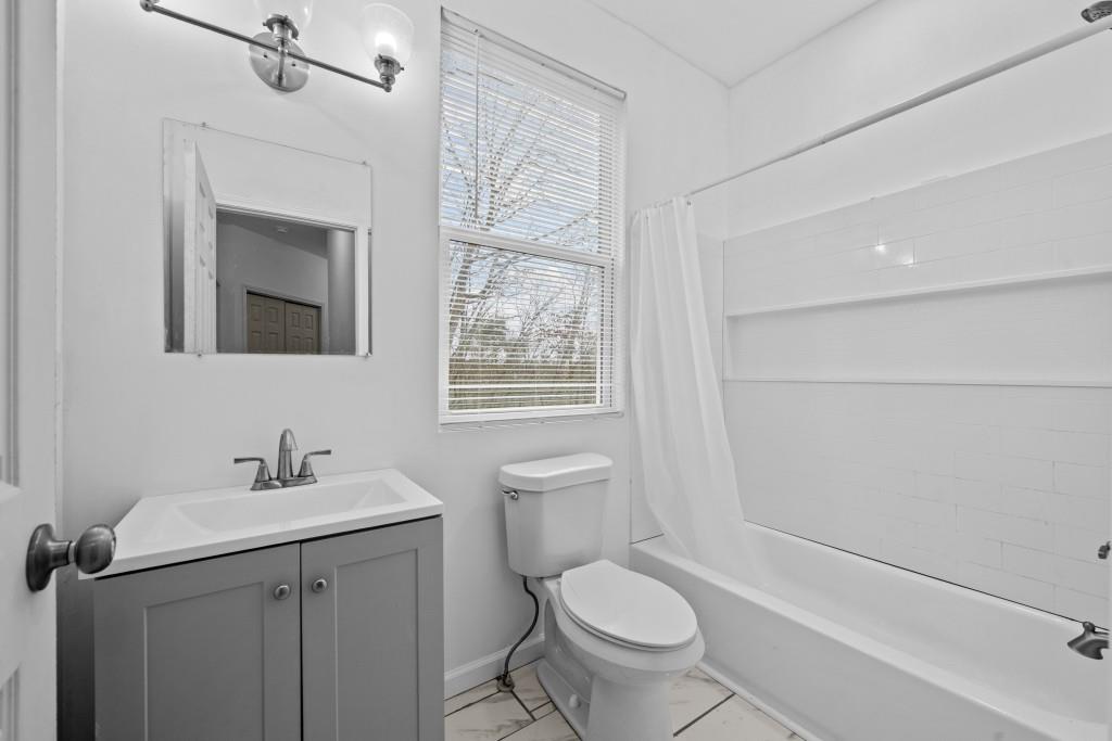 657 Summit Lane Ellijay, GA 30540 - Photo 30 of 33 a bathroom with a sink toilet and vanity