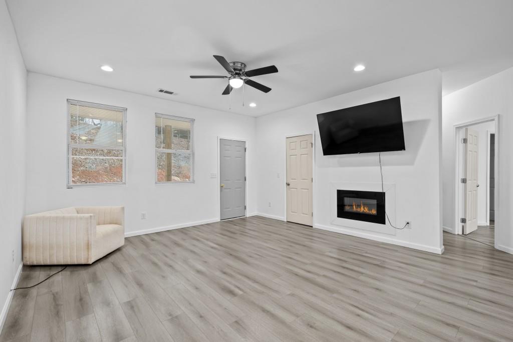 657 Summit Lane Ellijay, GA 30540 - Photo 7 of 33 a view of a livingroom with an empty space and a fireplace