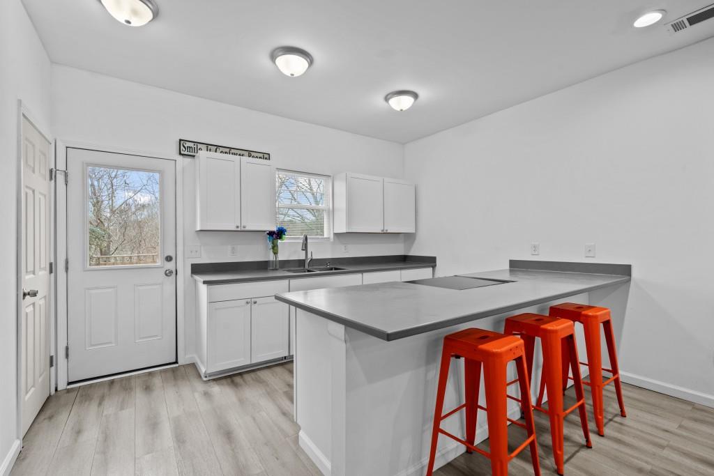 657 Summit Lane Ellijay, GA 30540 - Photo 9 of 33 a kitchen with stainless steel appliances granite countertop a stove a sink and a refrigerator