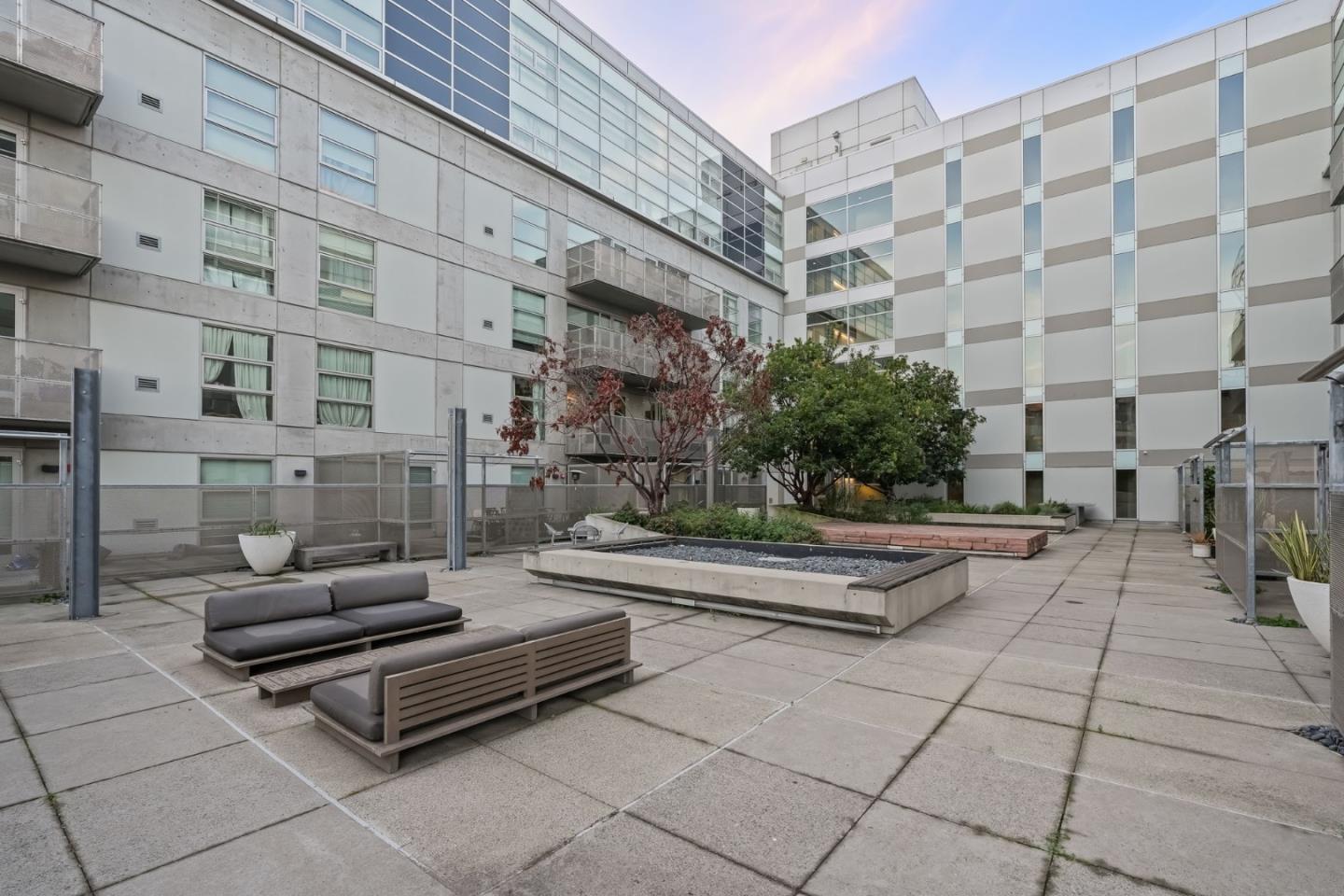 428 Alice Street, Unit 637 Oakland, CA 94607 - Photo 16 of 23 a bench sitting in front of a building