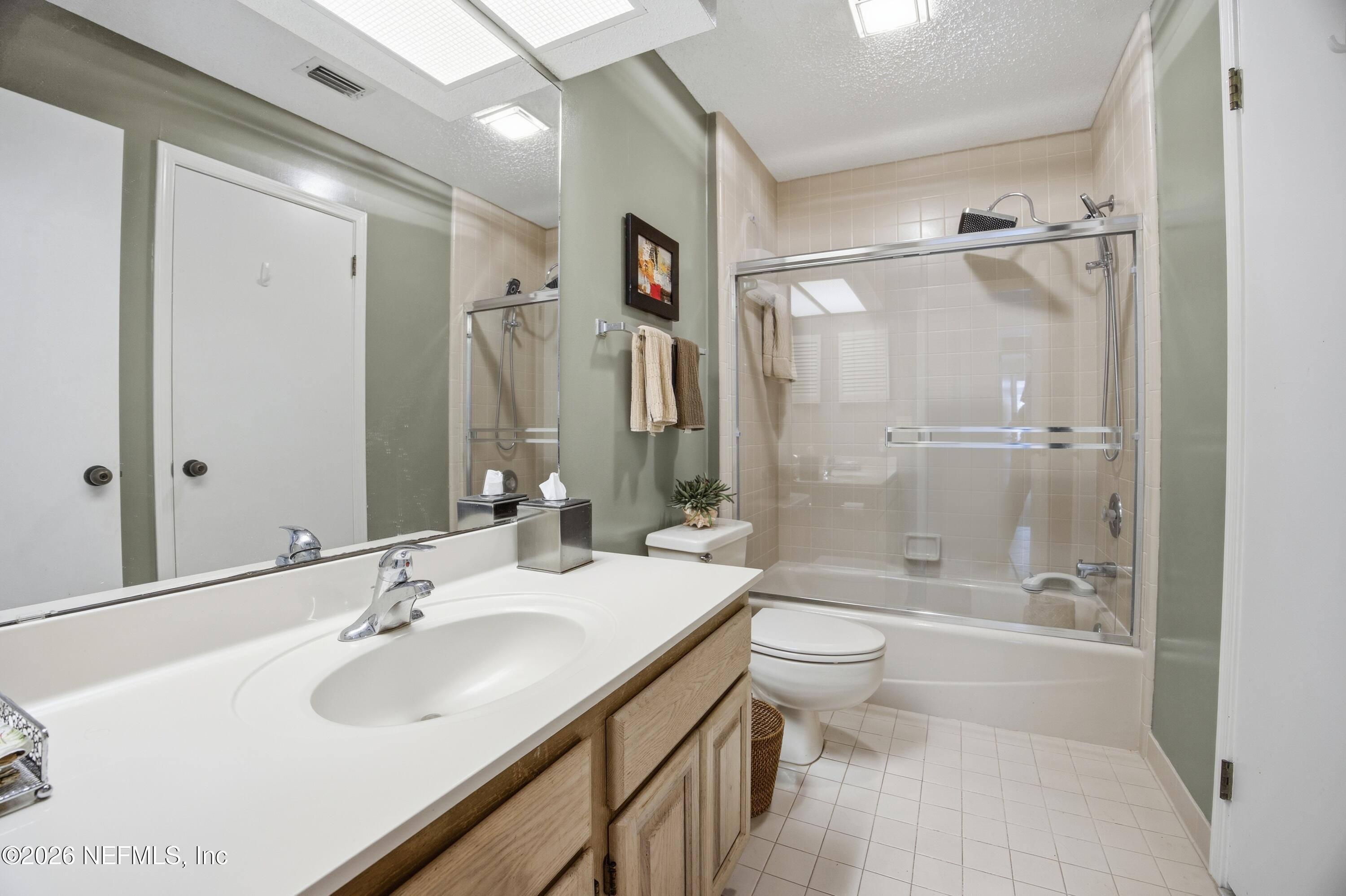94 Players Club Villas Road Ponte Vedra Beach, FL 32082 - Photo 19 of 25 a bathroom with a sink a toilet and shower