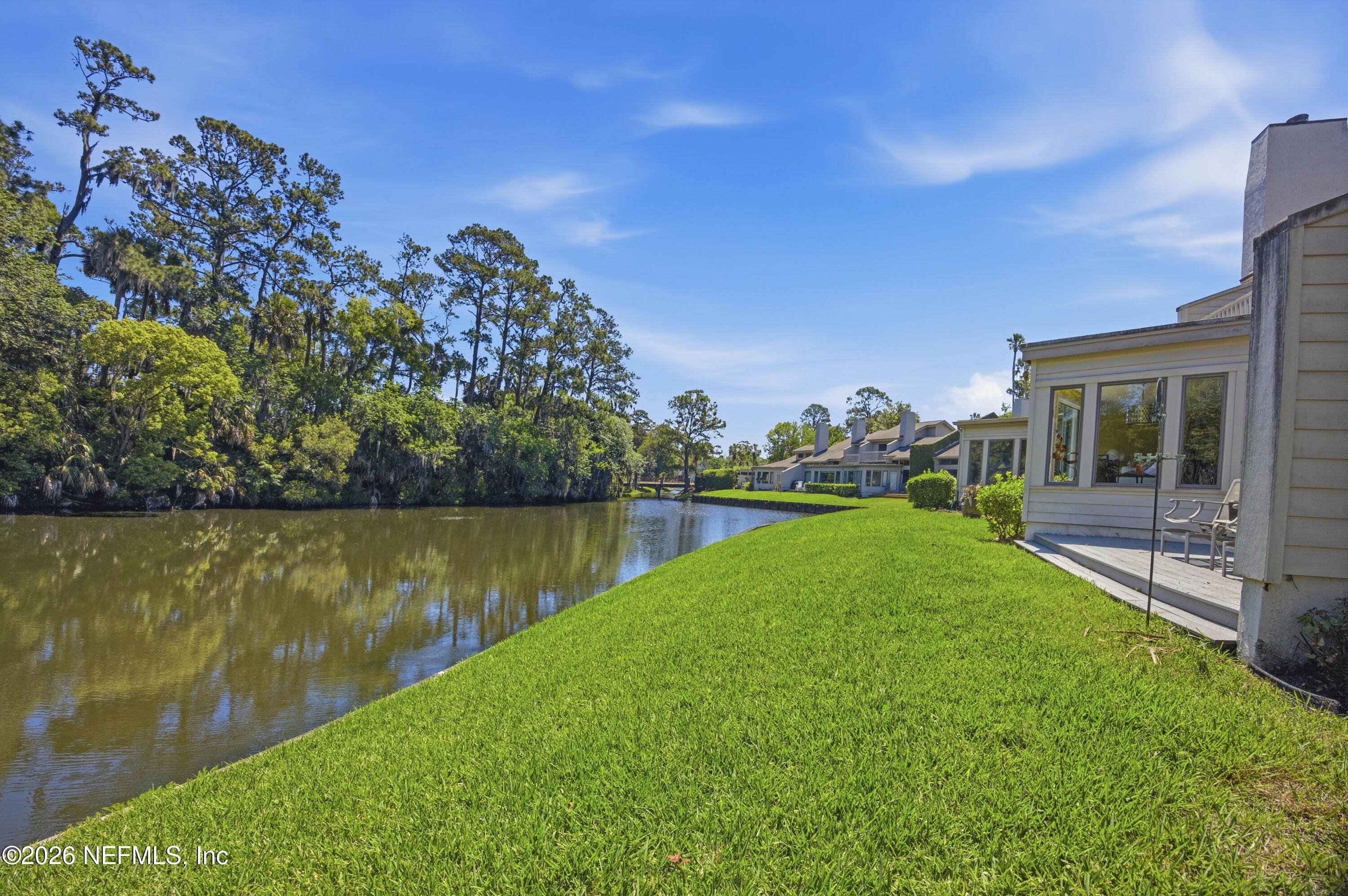 94 Players Club Villas Road Ponte Vedra Beach, FL 32082 - Photo 23 of 25 a view of a lake with a yard