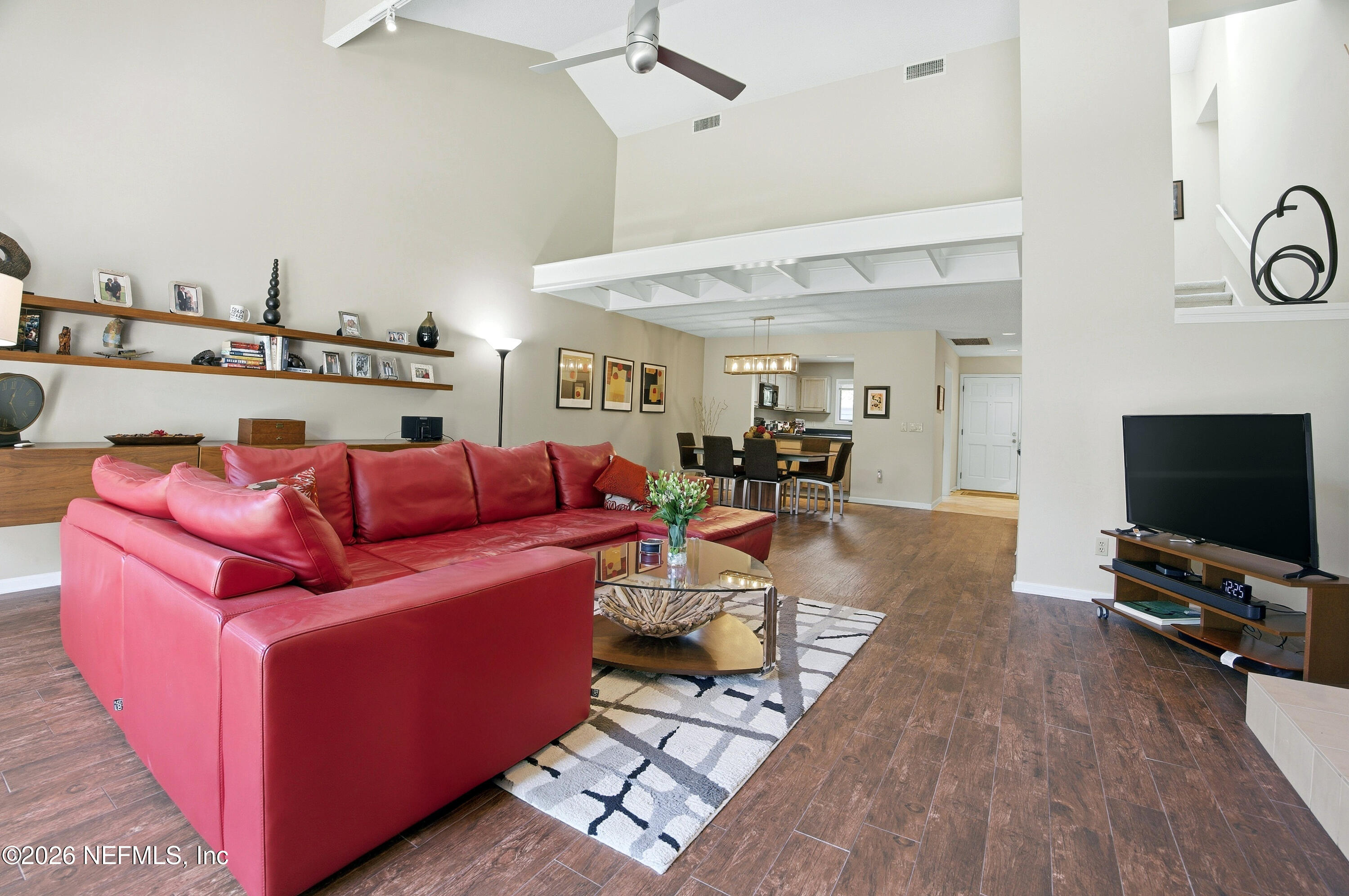 94 Players Club Villas Road Ponte Vedra Beach, FL 32082 - Photo 25 of 25 a living room with furniture and a flat screen tv