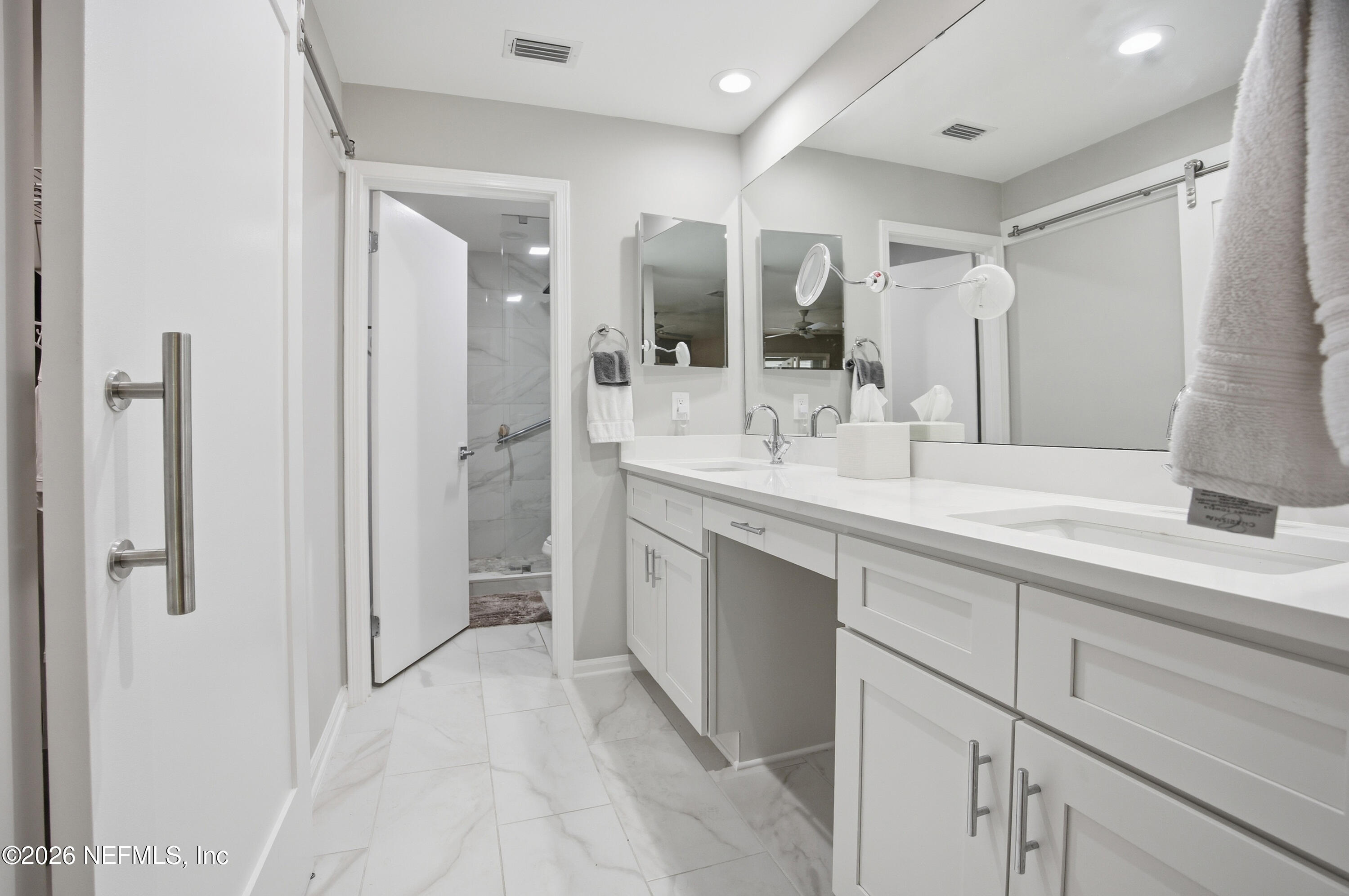 94 Players Club Villas Road Ponte Vedra Beach, FL 32082 - Photo 5 of 25 a bathroom with a double vanity sink mirror and double