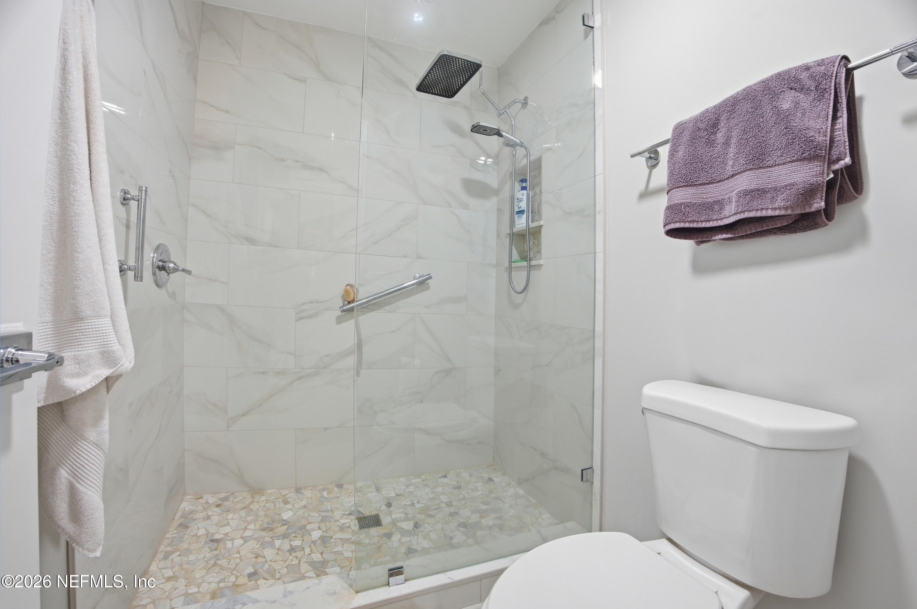 94 Players Club Villas Road Ponte Vedra Beach, FL 32082 - Photo 6 of 25 a white toilet sitting next to a bath tub shower