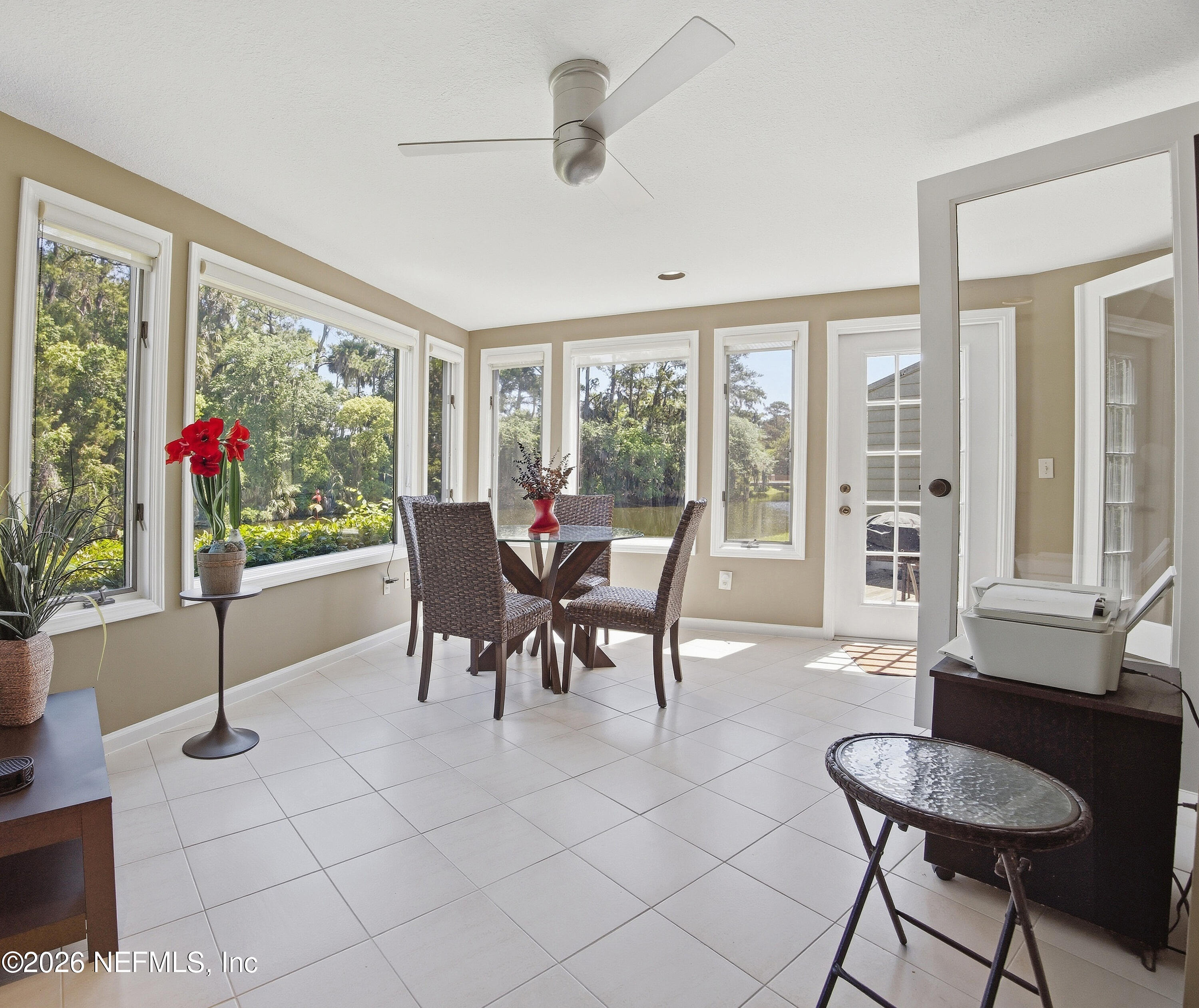 94 Players Club Villas Road Ponte Vedra Beach, FL 32082 - Photo 7 of 25 a dining room with furniture and a floor to ceiling window