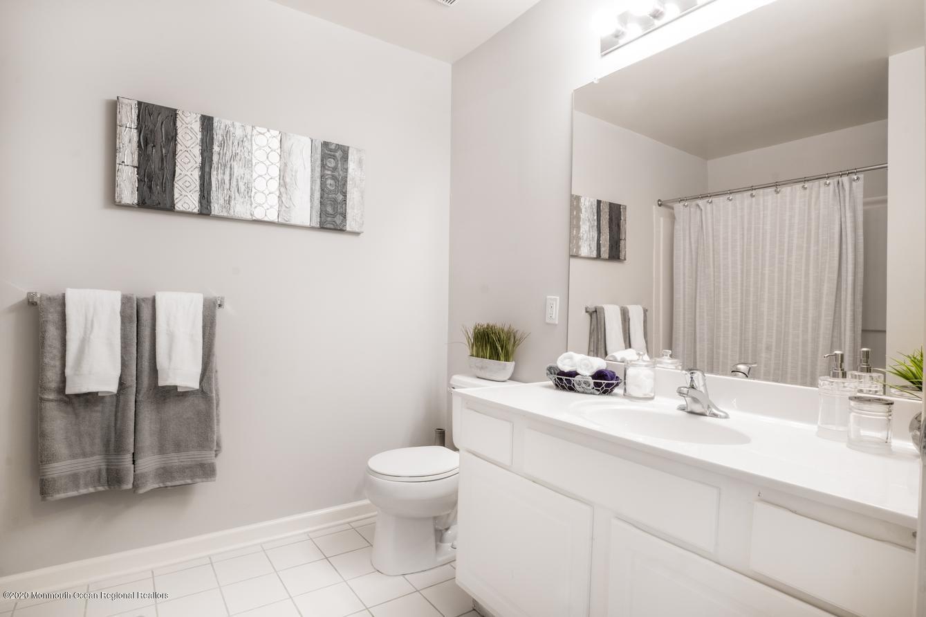 914 Timber Ridge Court Neptune Township, NJ 07753 - Photo 13 of 15 a bathroom with a sink toilet and shower