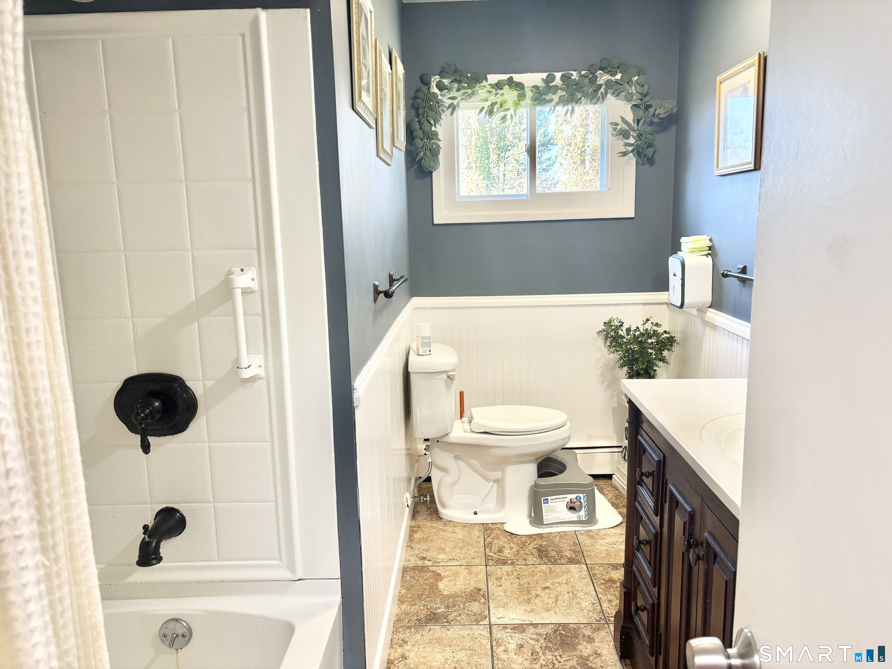 40 Rentschler Street East Hartford, CT 06118 - Photo 11 of 14 a white toilet sitting next to a bathroom sink