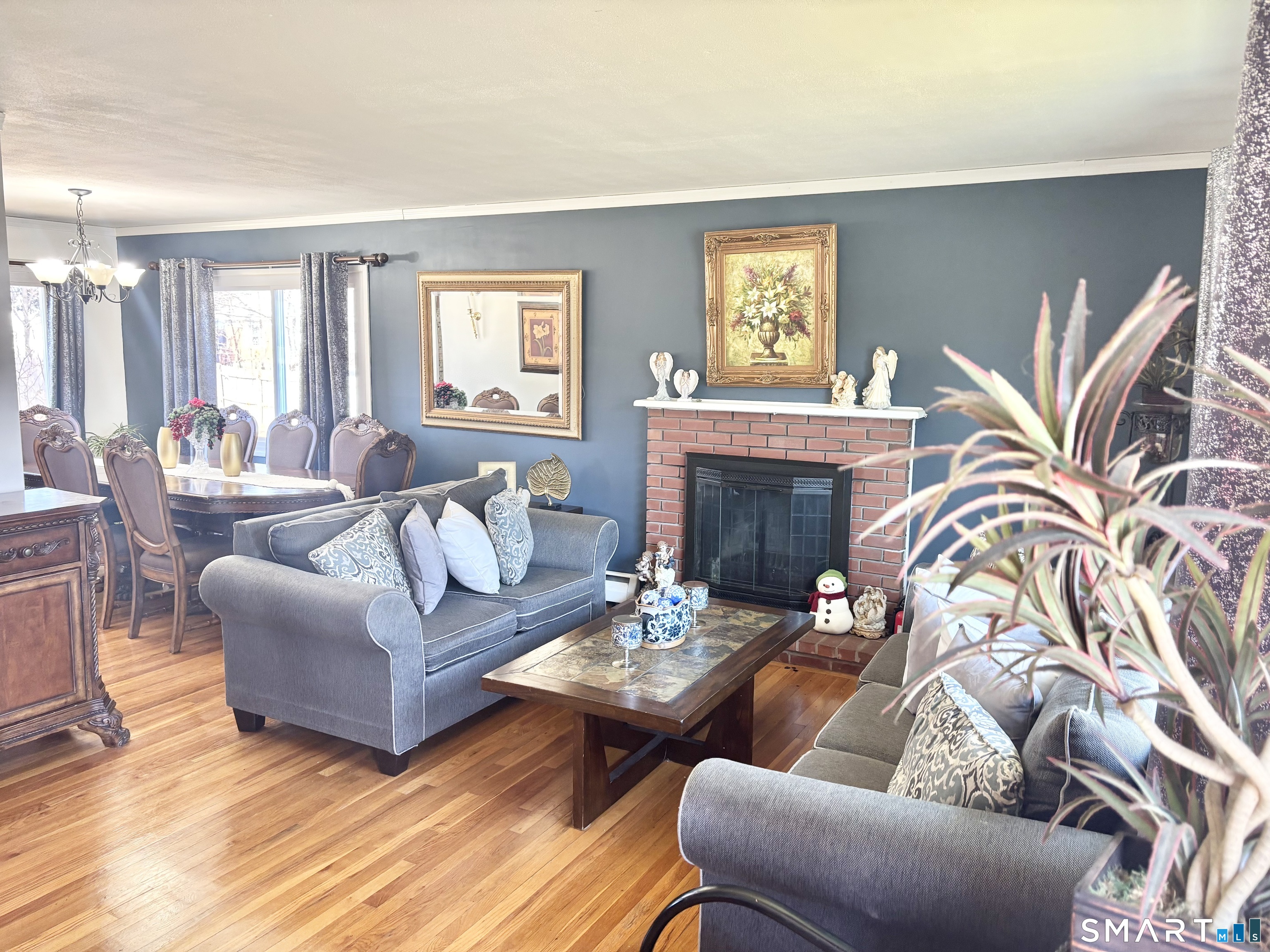40 Rentschler Street East Hartford, CT 06118 - Photo 2 of 14 a living room with furniture and a fireplace
