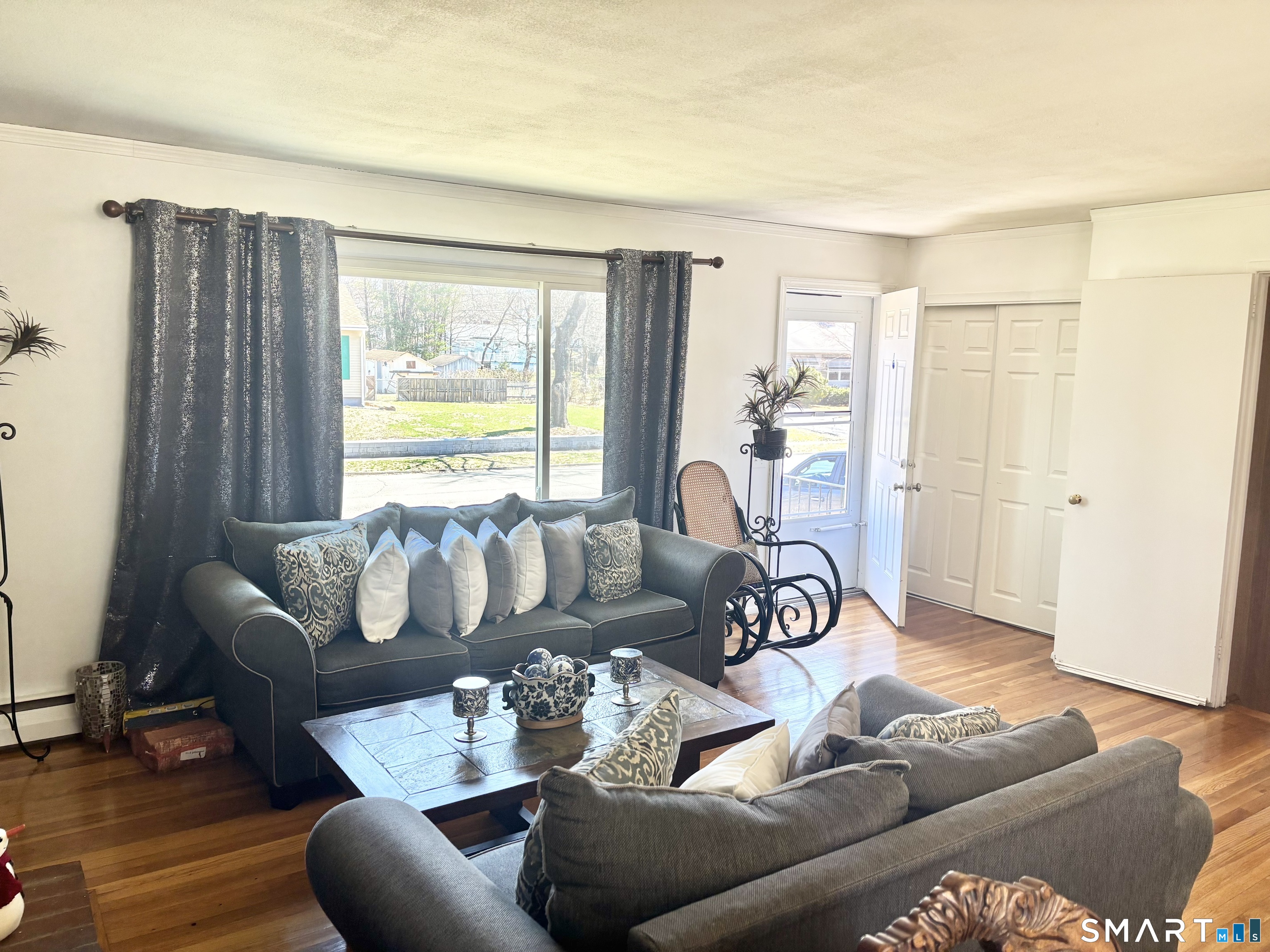 40 Rentschler Street East Hartford, CT 06118 - Photo 3 of 14 a living room with furniture and a large window