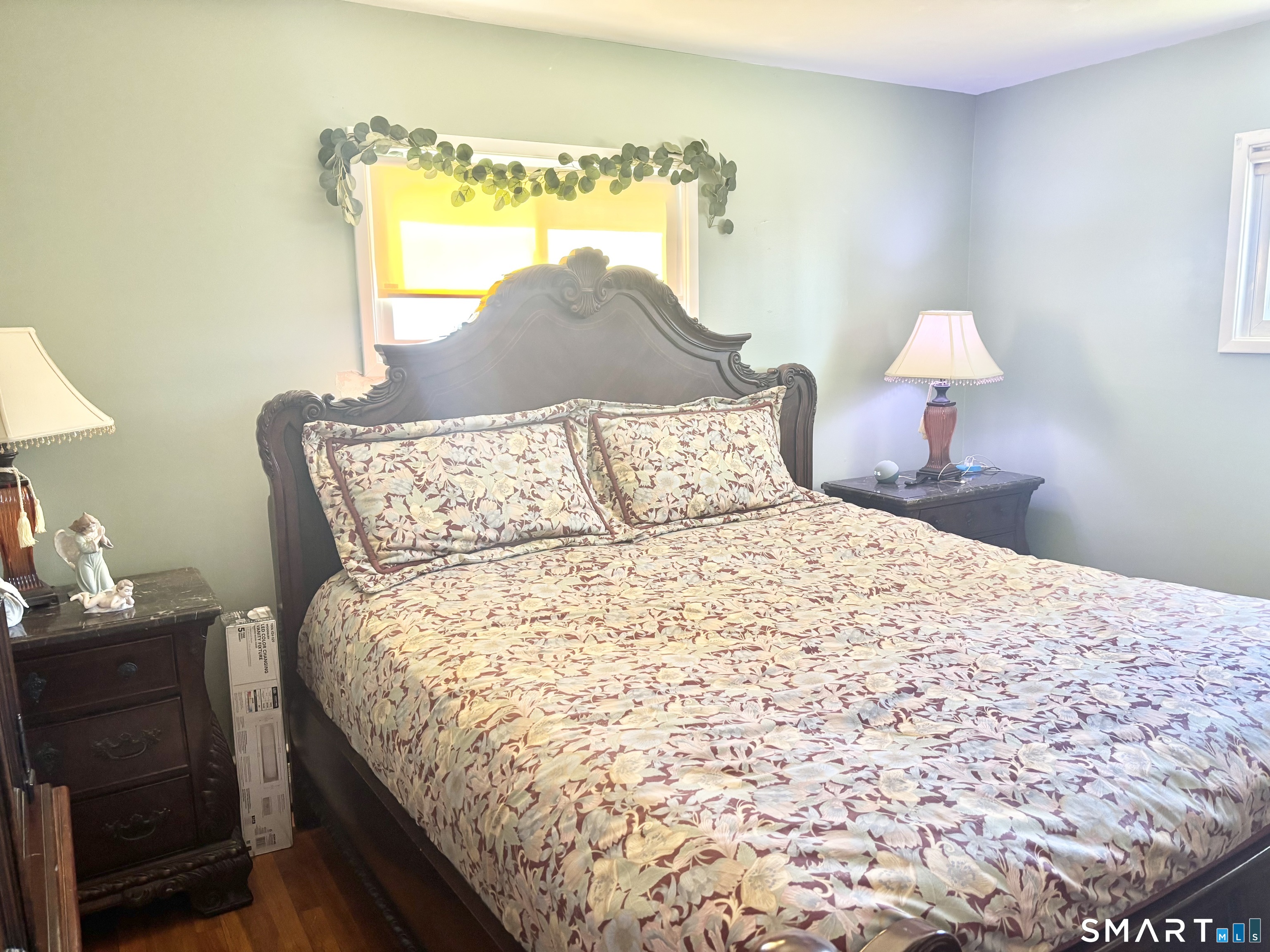 40 Rentschler Street East Hartford, CT 06118 - Photo 8 of 14 a bedroom with a bed and a window