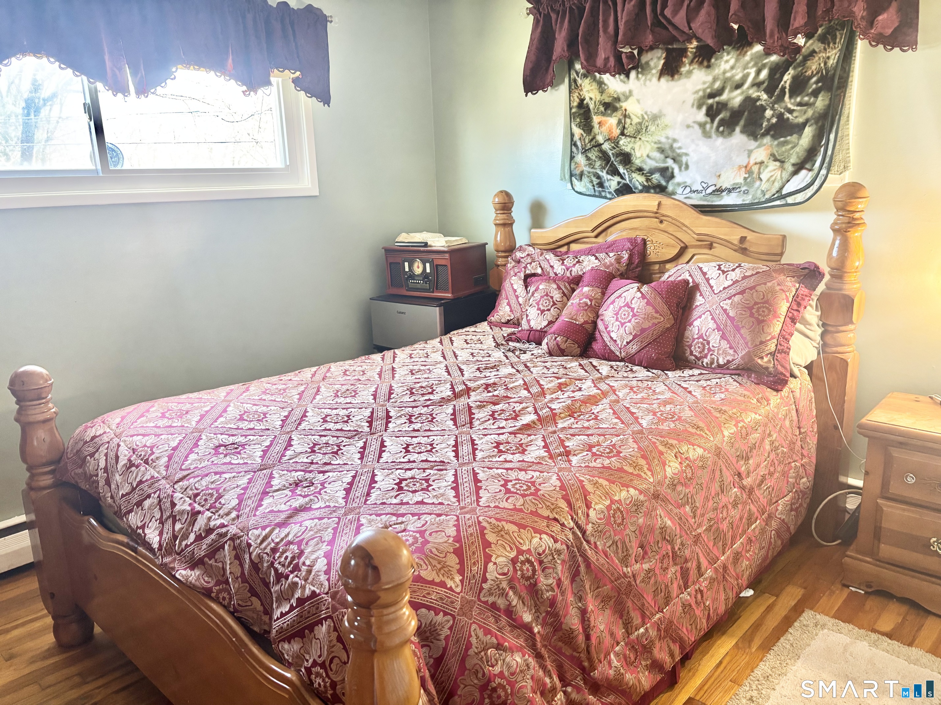 40 Rentschler Street East Hartford, CT 06118 - Photo 9 of 14 a bedroom with a bed and a window
