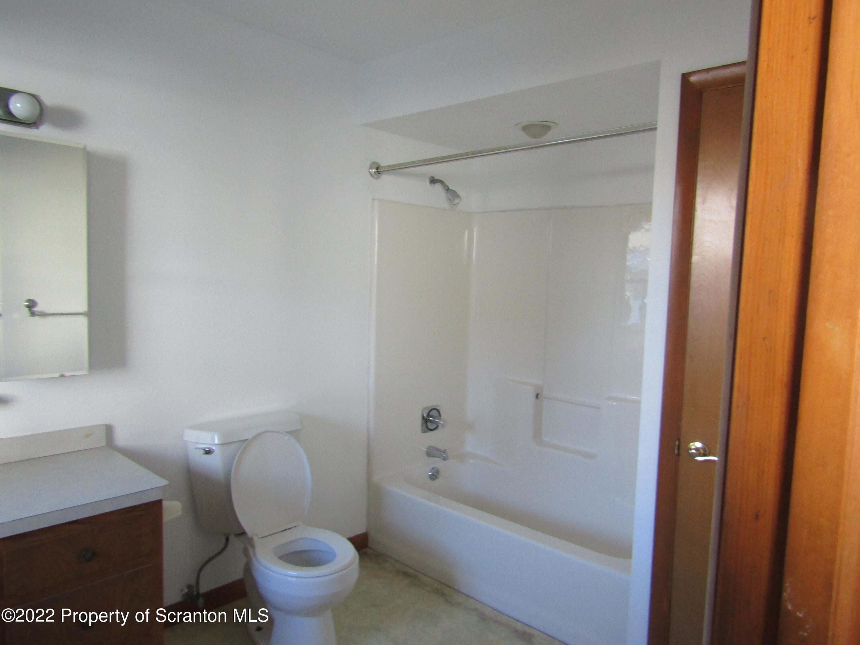 43 Prospect Street Pittston, PA 18640 - Photo 12 of 32 a bathroom with a sink a toilet and shower