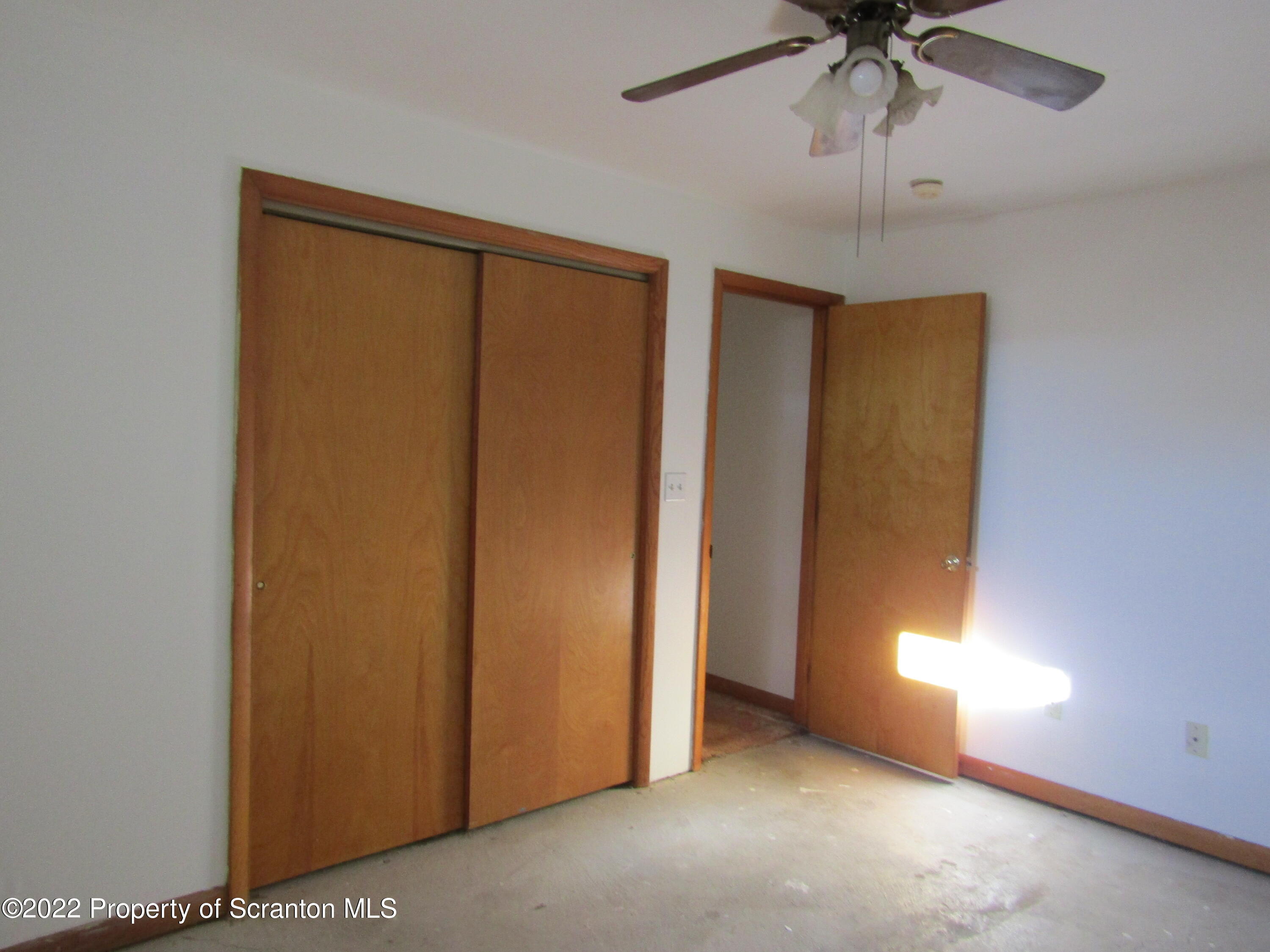 43 Prospect Street Pittston, PA 18640 - Photo 14 of 32 an empty room with windows and fan