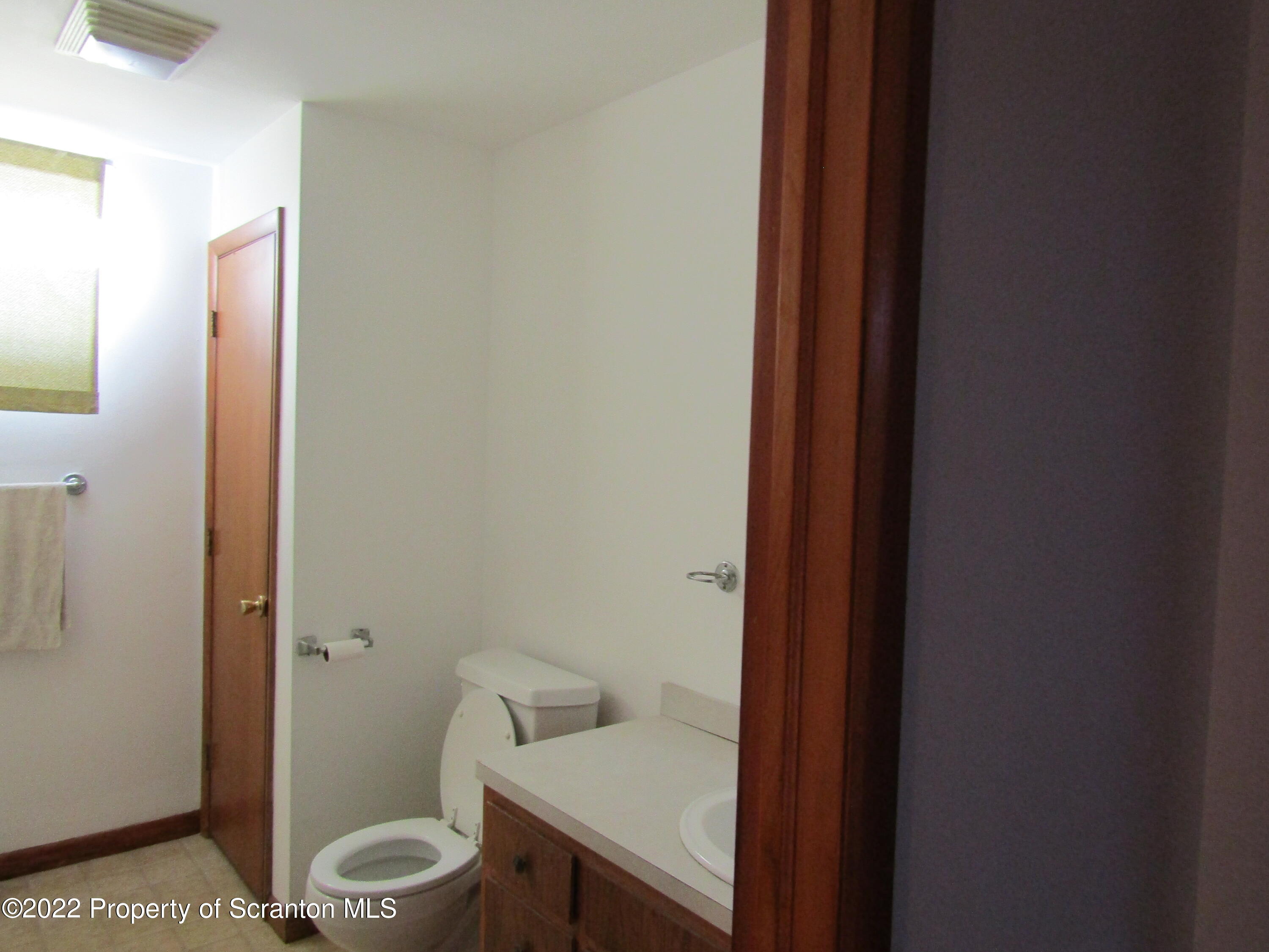 43 Prospect Street Pittston, PA 18640 - Photo 19 of 32 a bathroom with a granite countertop toilet and a sink