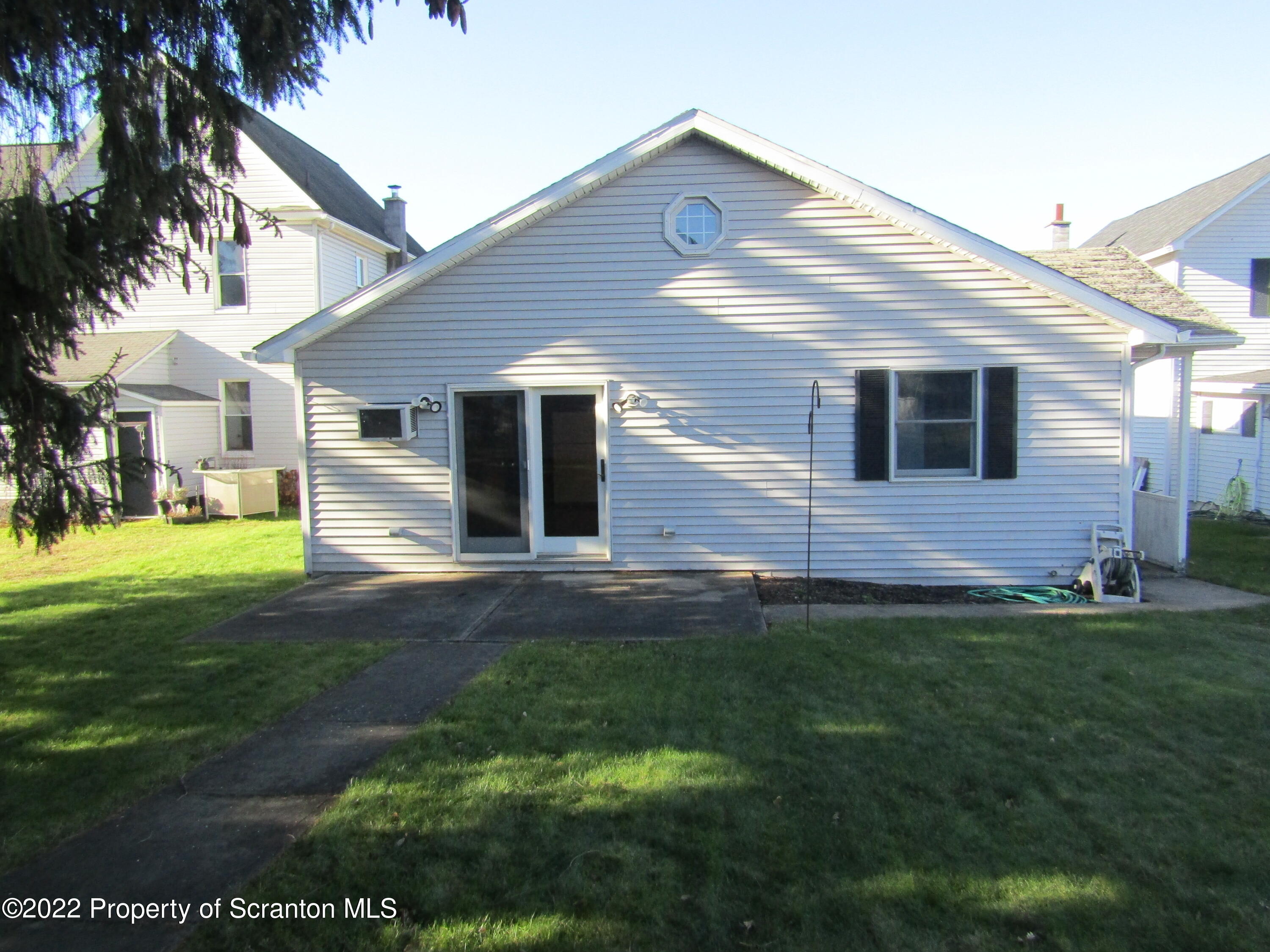 43 Prospect Street Pittston, PA 18640 - Photo 2 of 32 a front view of a house with a yard