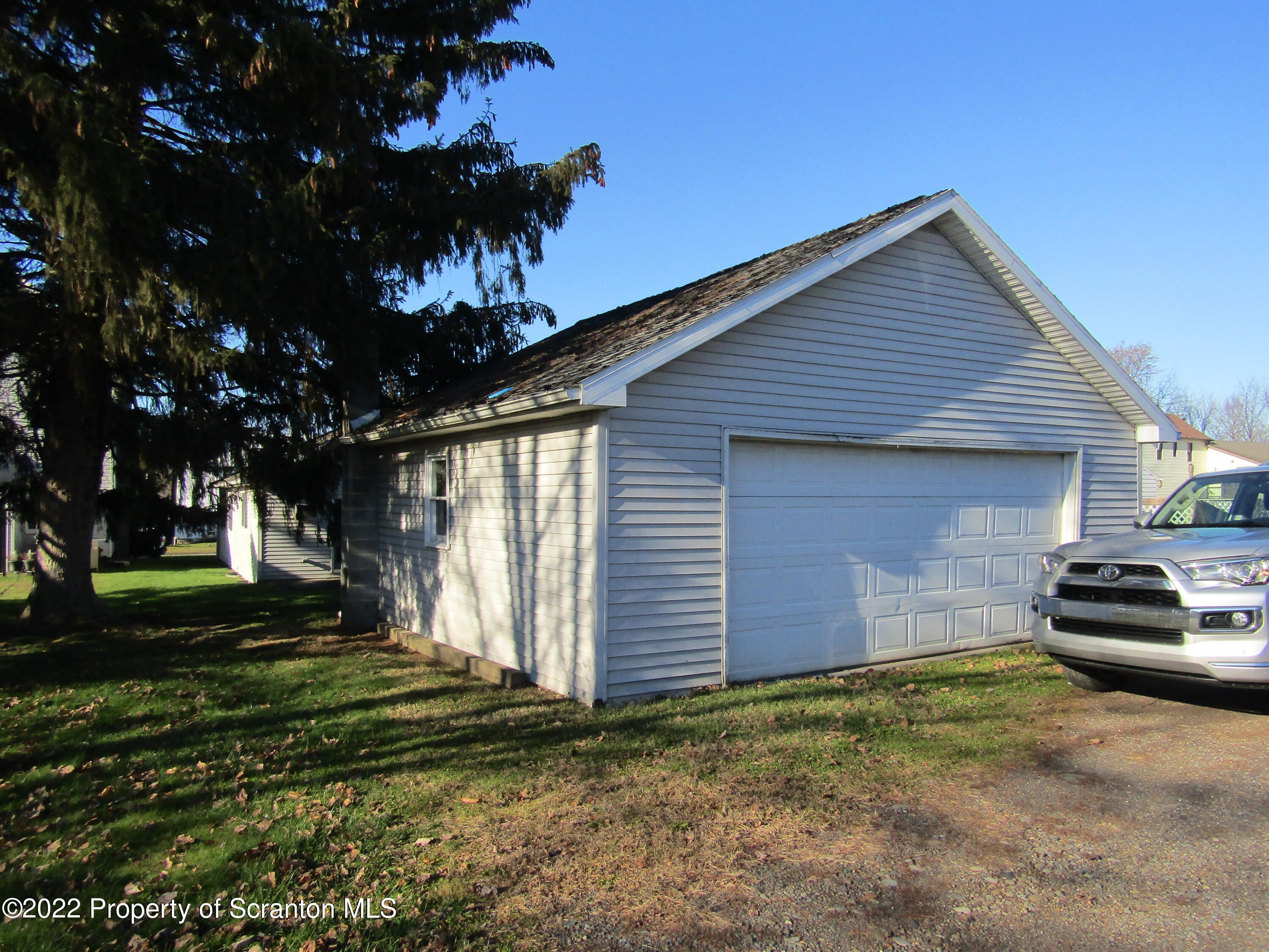 43 Prospect Street Pittston, PA 18640 - Photo 4 of 32 a front view of a house with a yard