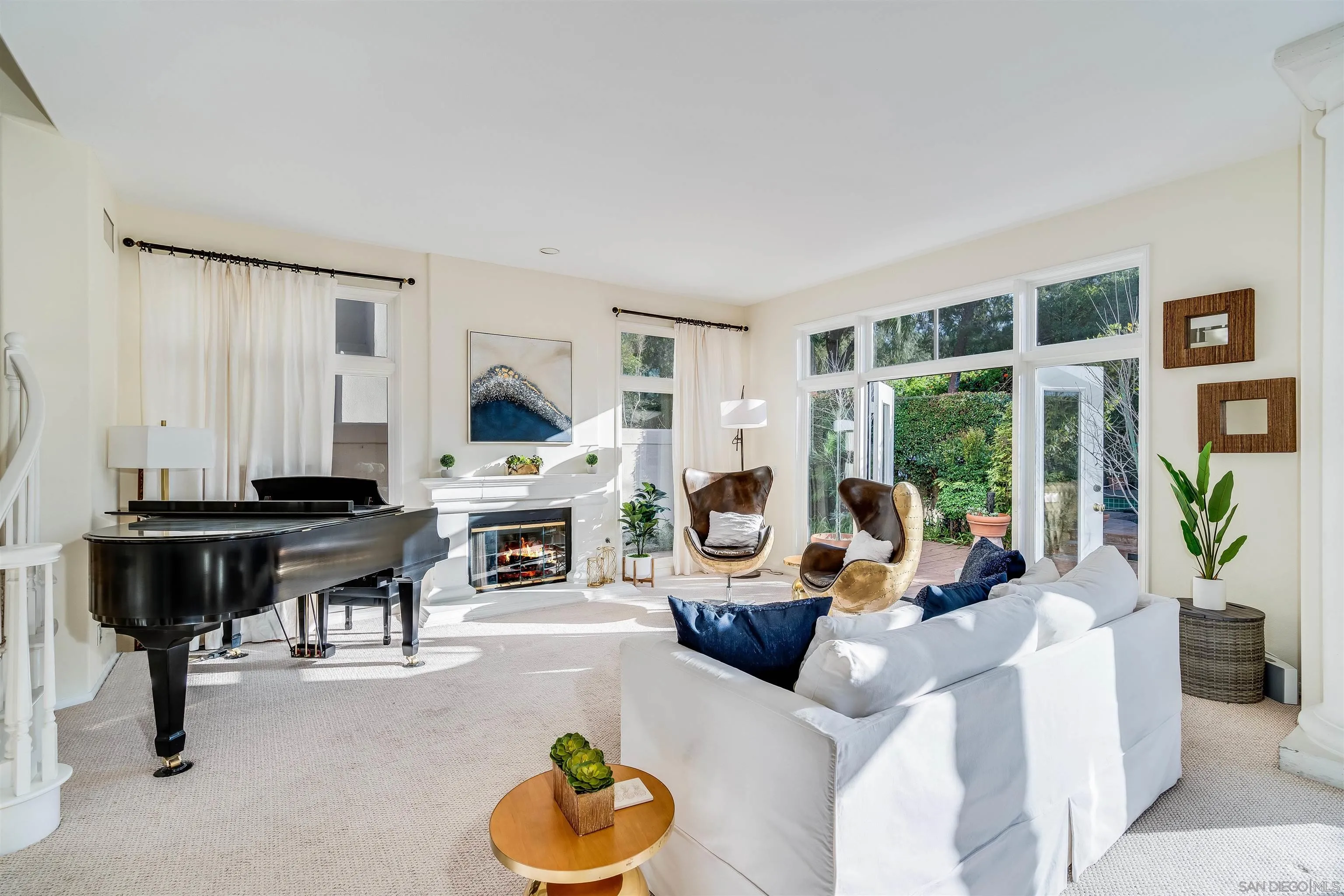 9636 Claiborne Square La Jolla, CA 92037 - Photo 11 of 48 a living room with furniture and a fireplace