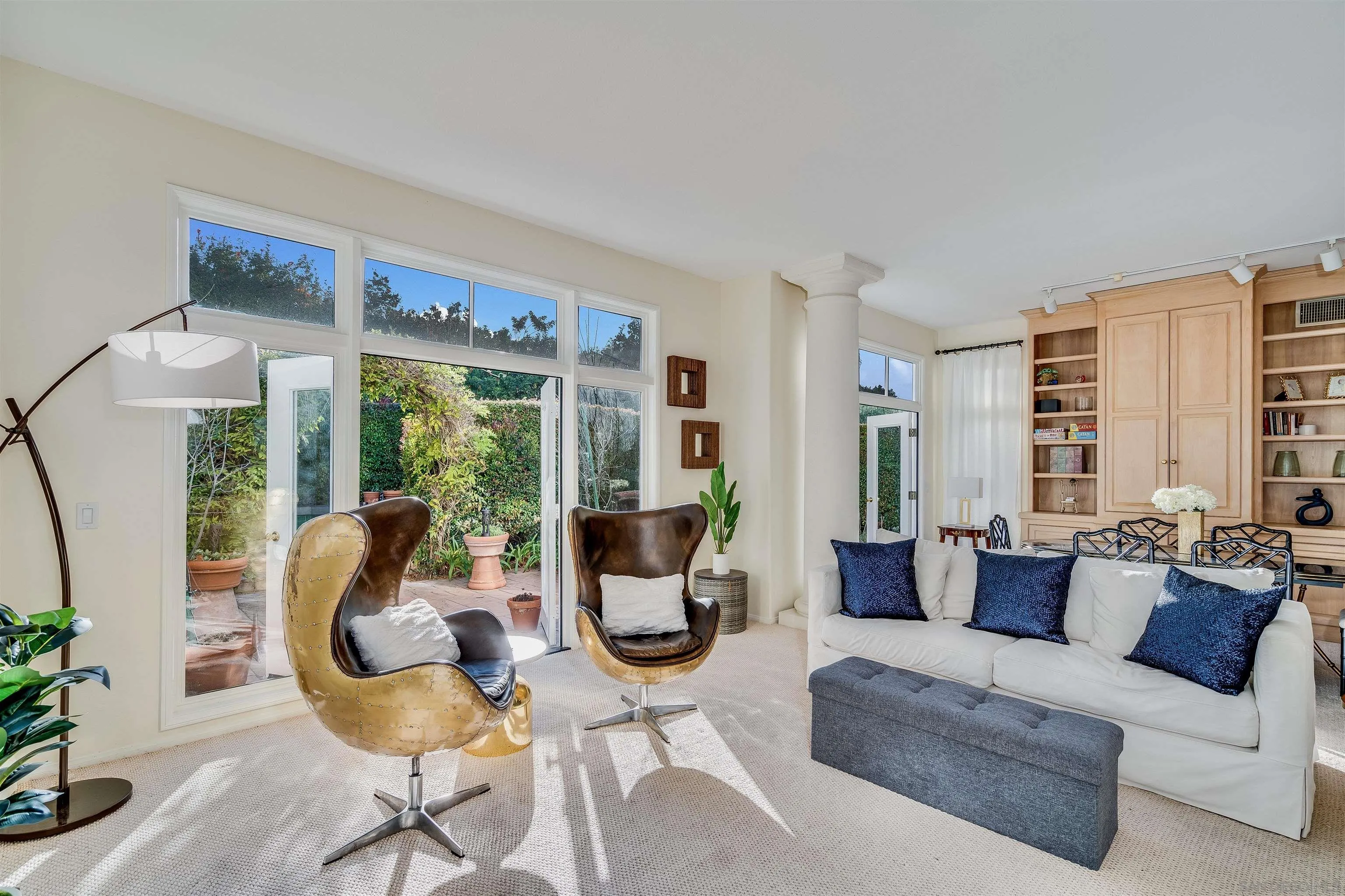 9636 Claiborne Square La Jolla, CA 92037 - Photo 12 of 48 a living room with furniture and a large window