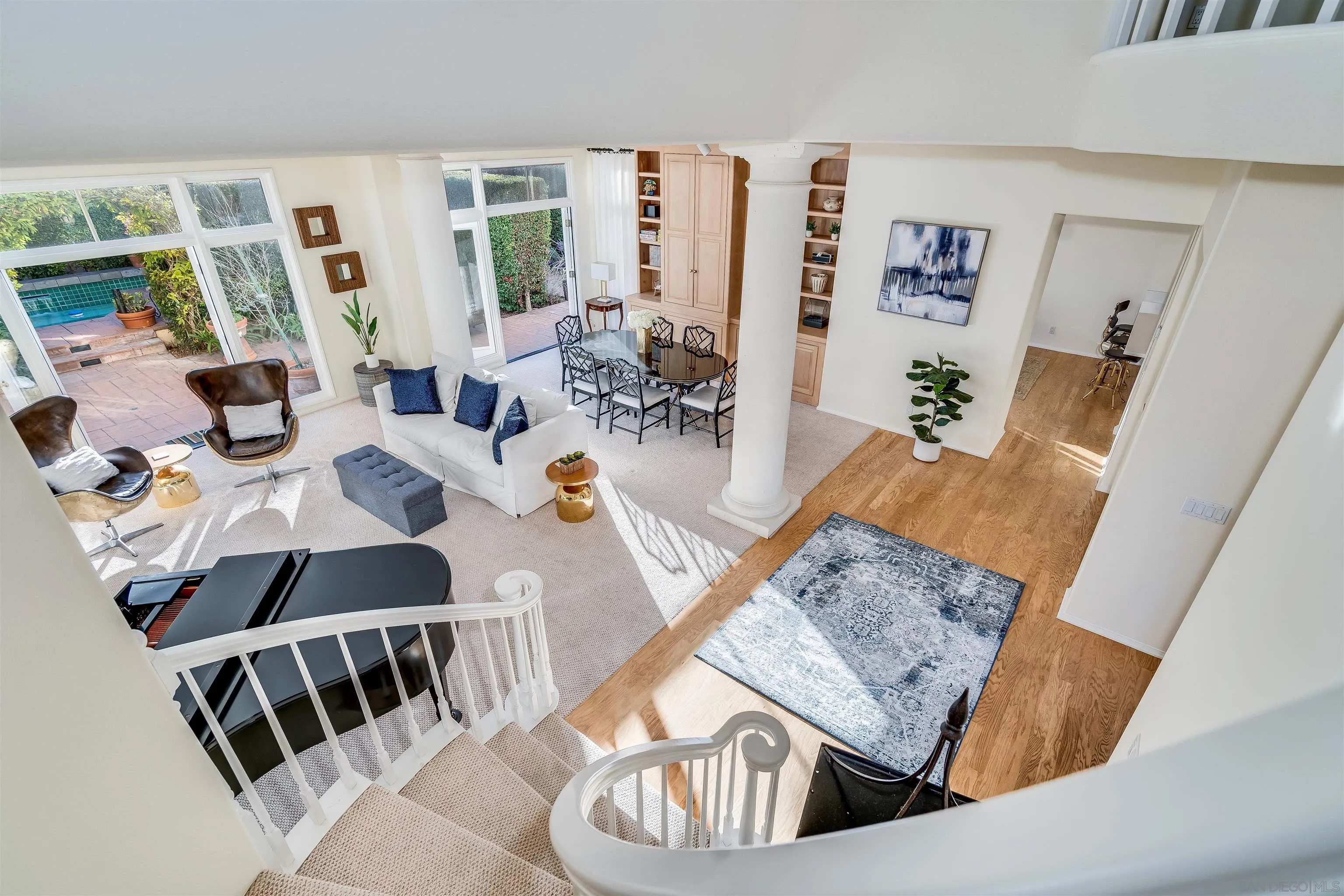 9636 Claiborne Square La Jolla, CA 92037 - Photo 15 of 48 a living room with furniture and wooden floor