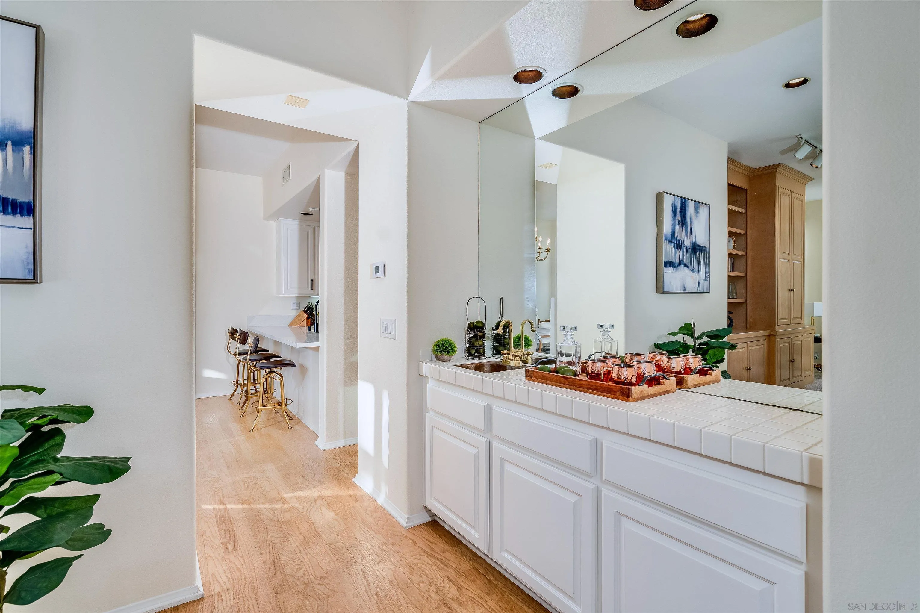 9636 Claiborne Square La Jolla, CA 92037 - Photo 17 of 48 a view of a hallway and a dining room