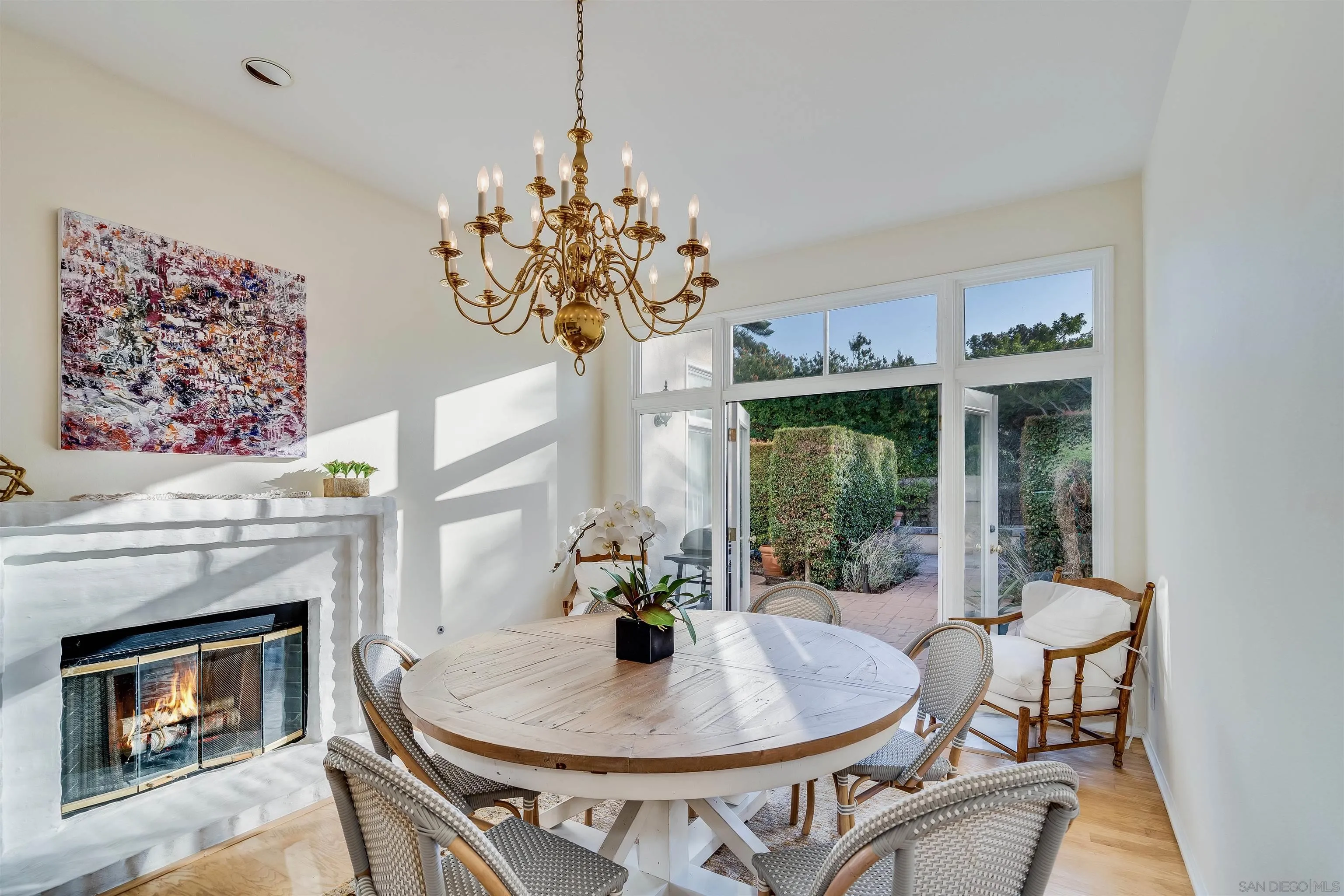 9636 Claiborne Square La Jolla, CA 92037 - Photo 18 of 48 a view of a dining room with furniture window and wooden floor