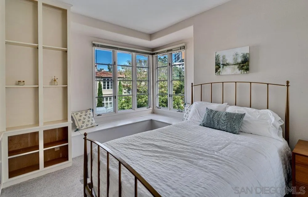 9636 Claiborne Square La Jolla, CA 92037 - Photo 31 of 48 a bedroom with a large bed and a window