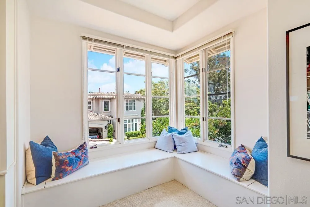 9636 Claiborne Square La Jolla, CA 92037 - Photo 32 of 48 a living room with furniture and a large window