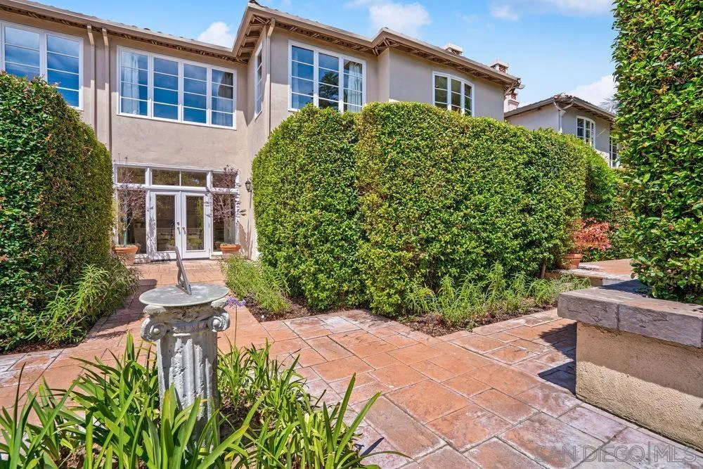 9636 Claiborne Square La Jolla, CA 92037 - Photo 39 of 48 a front view of a house with garden