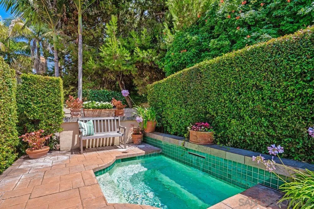 9636 Claiborne Square La Jolla, CA 92037 - Photo 46 of 48 a view of a deck with a big yard potted plants and large tree
