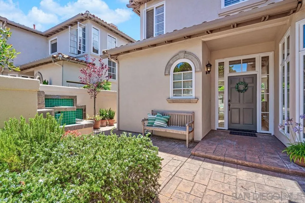 9636 Claiborne Square La Jolla, CA 92037 - Photo 6 of 48 a view of a house with backyard and sitting area