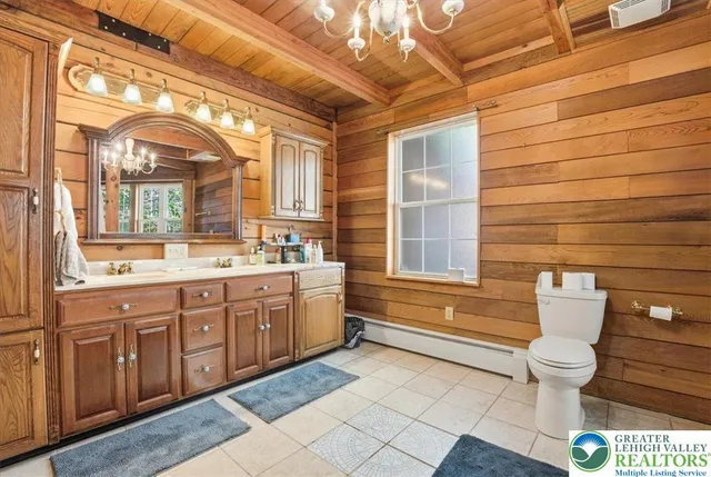 a view of a patio with furniture and a backyard