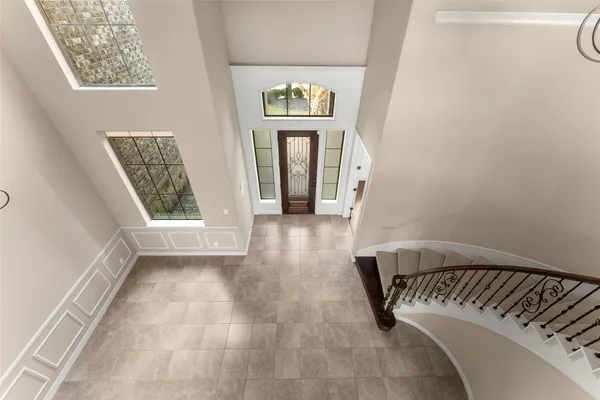 a view of an entryway with wooden floor