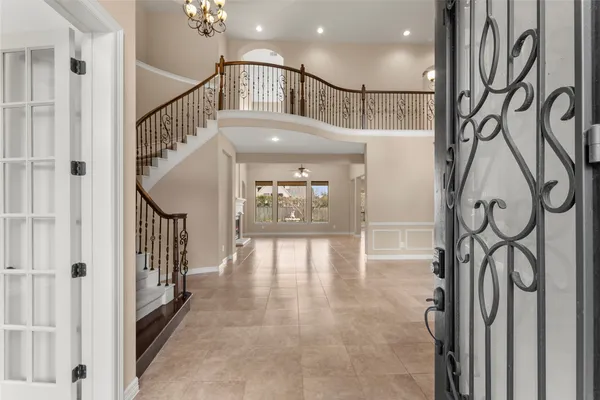 a view of staircase with lots of frames and stairs