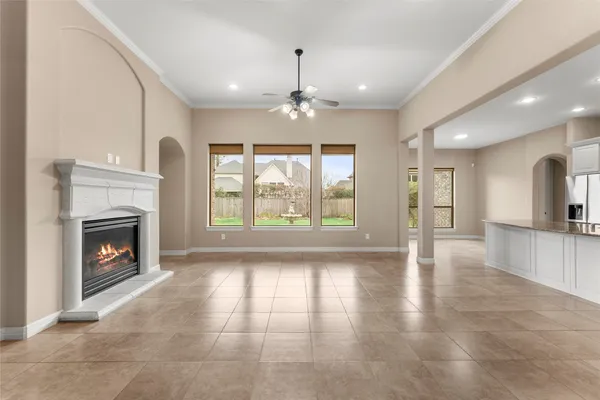 a view of livingroom with fireplace window and wooden floor