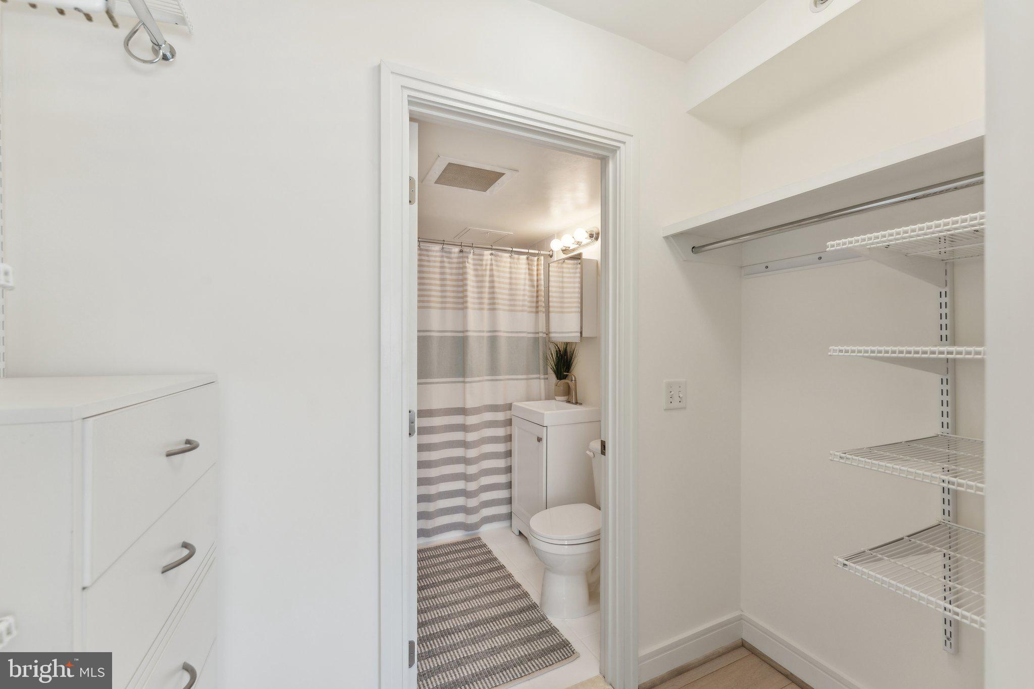 800 4th Street Southwest, Unit S419 Washington, DC 20024 - Photo 21 of 32 a bathroom with a shower and a sink