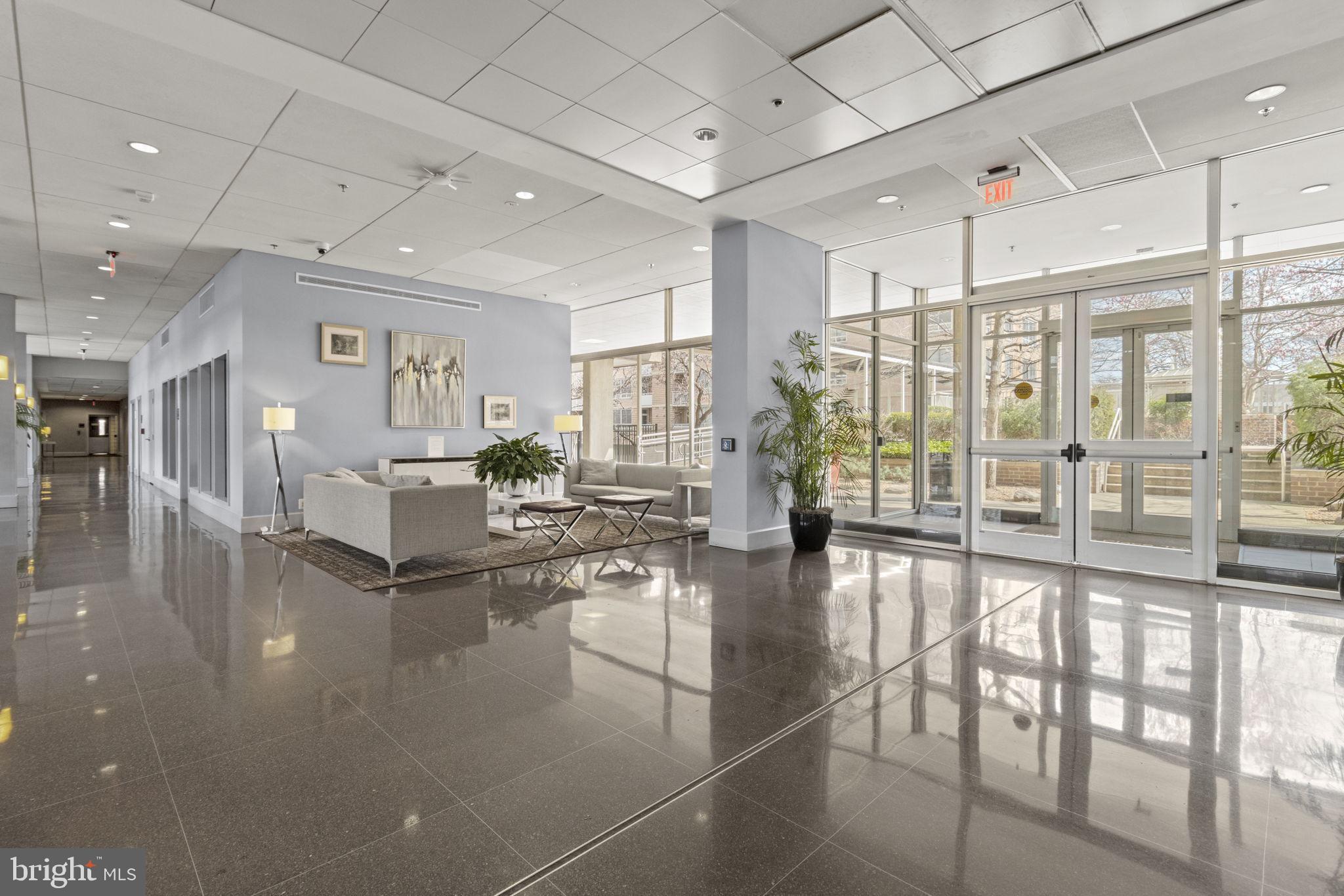 800 4th Street Southwest, Unit S419 Washington, DC 20024 - Photo 32 of 32 a lobby with furniture and floor to ceiling window