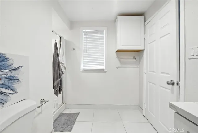 a bathroom with a bathtub and shower