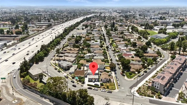 an aerial view of residential houses with outdoor space