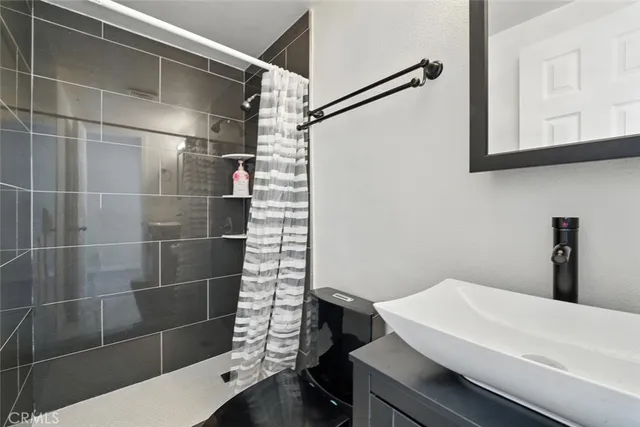 a bathroom with a sink and a shower