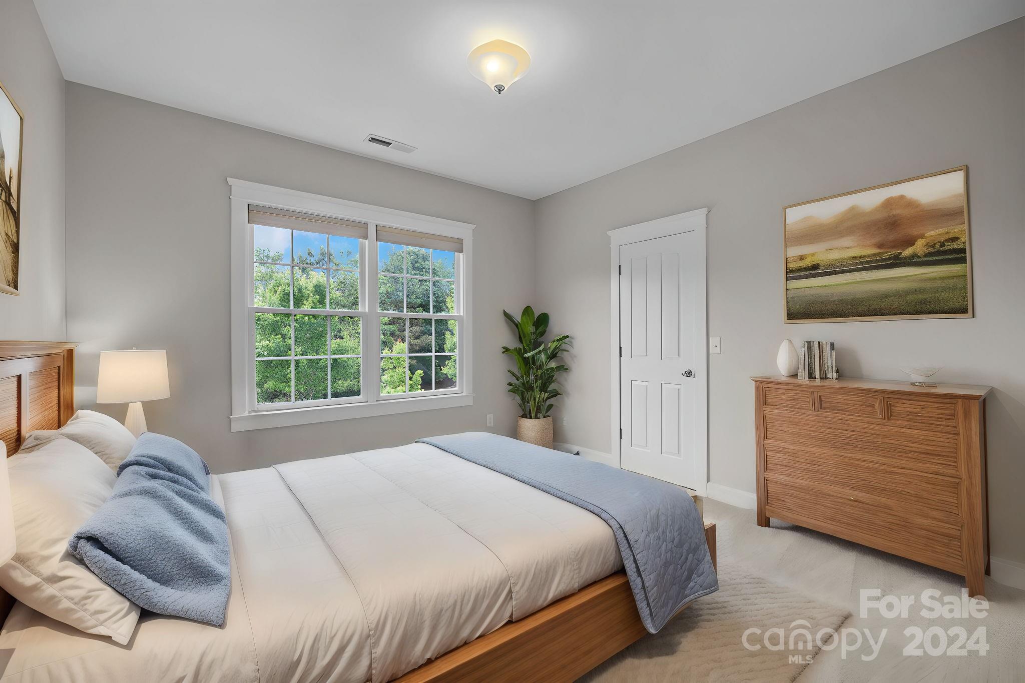 4168 Birkshire Heights Fort Mill, SC 29708 - Photo 17 of 35 a bedroom with a bed and a flat screen tv