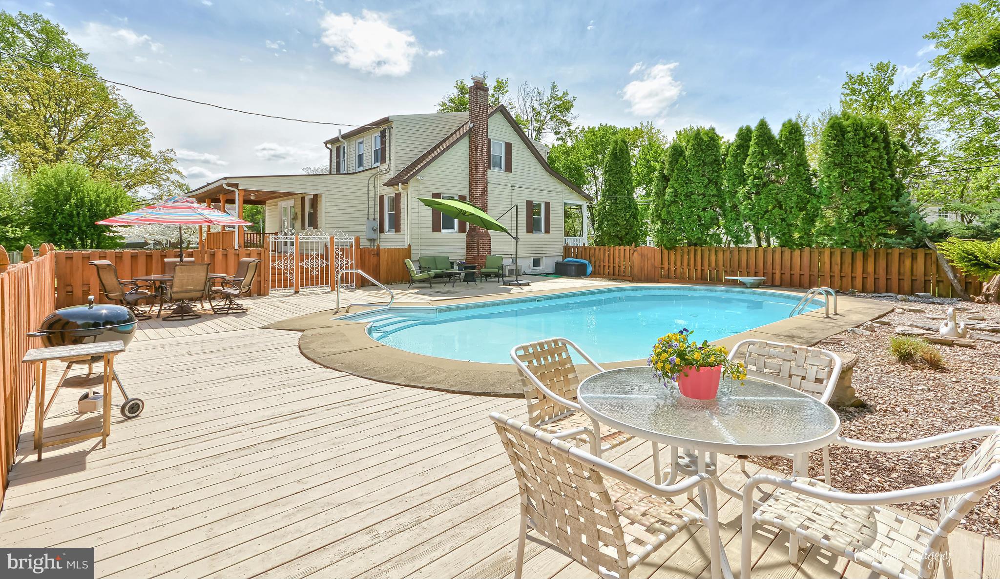1651 Shookstown Road Frederick, MD 21702 - Photo 22 of 30 a front view of a house with swimming pool and sitting area